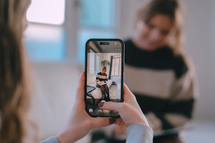 Content creator filming with a smartphone