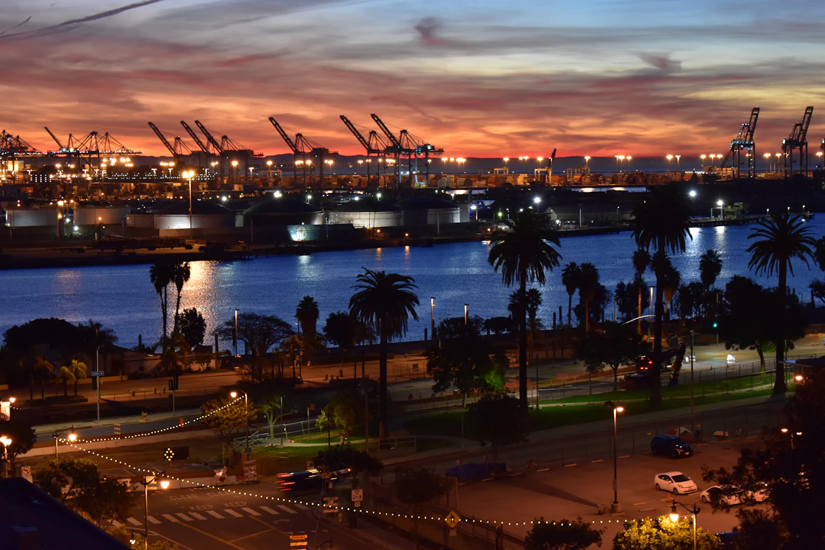 Container terminal cranes at dusk on the US West Coast, gateway port for China to USA shipping