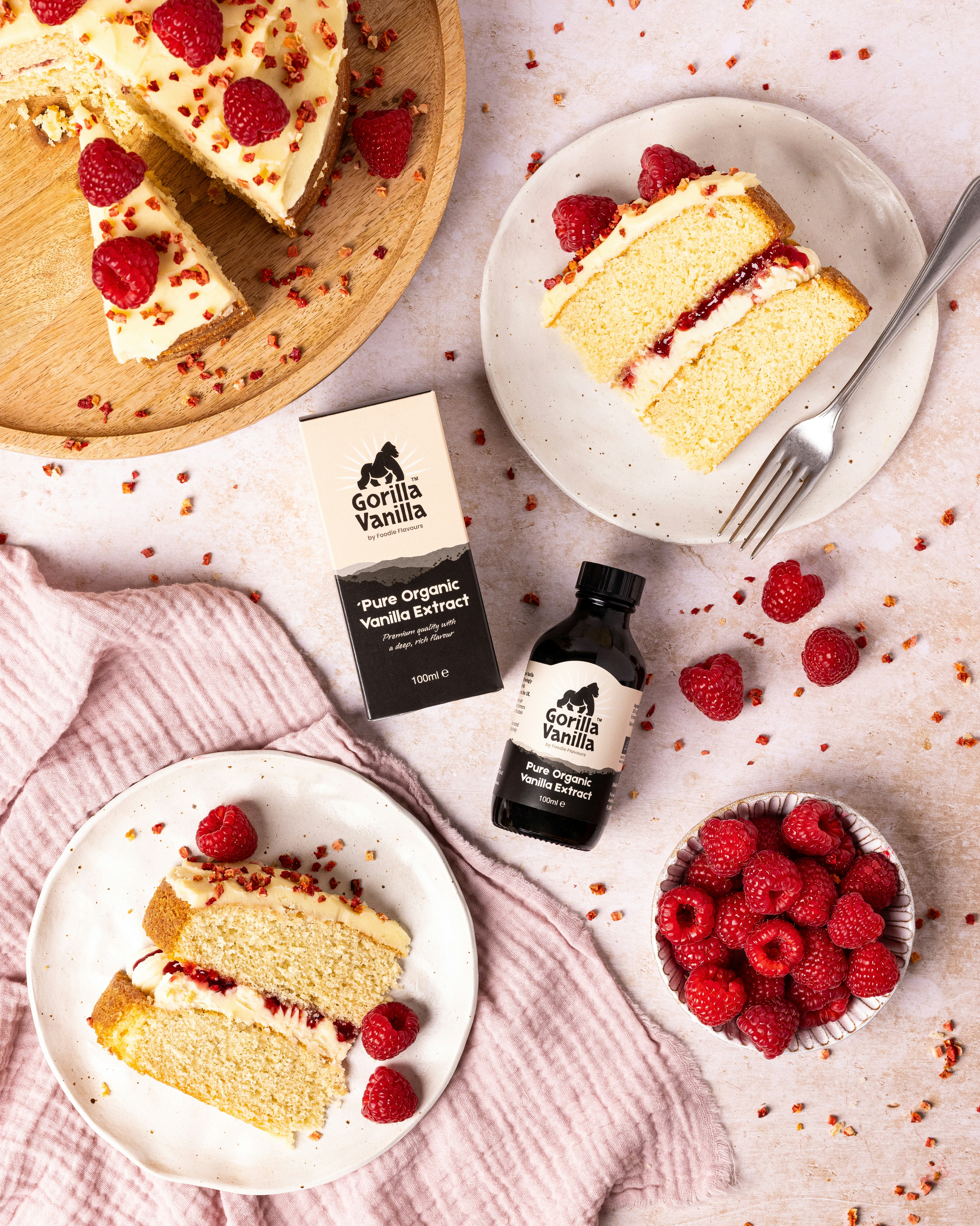 A vanilla cake with raspberries and vanilla extract