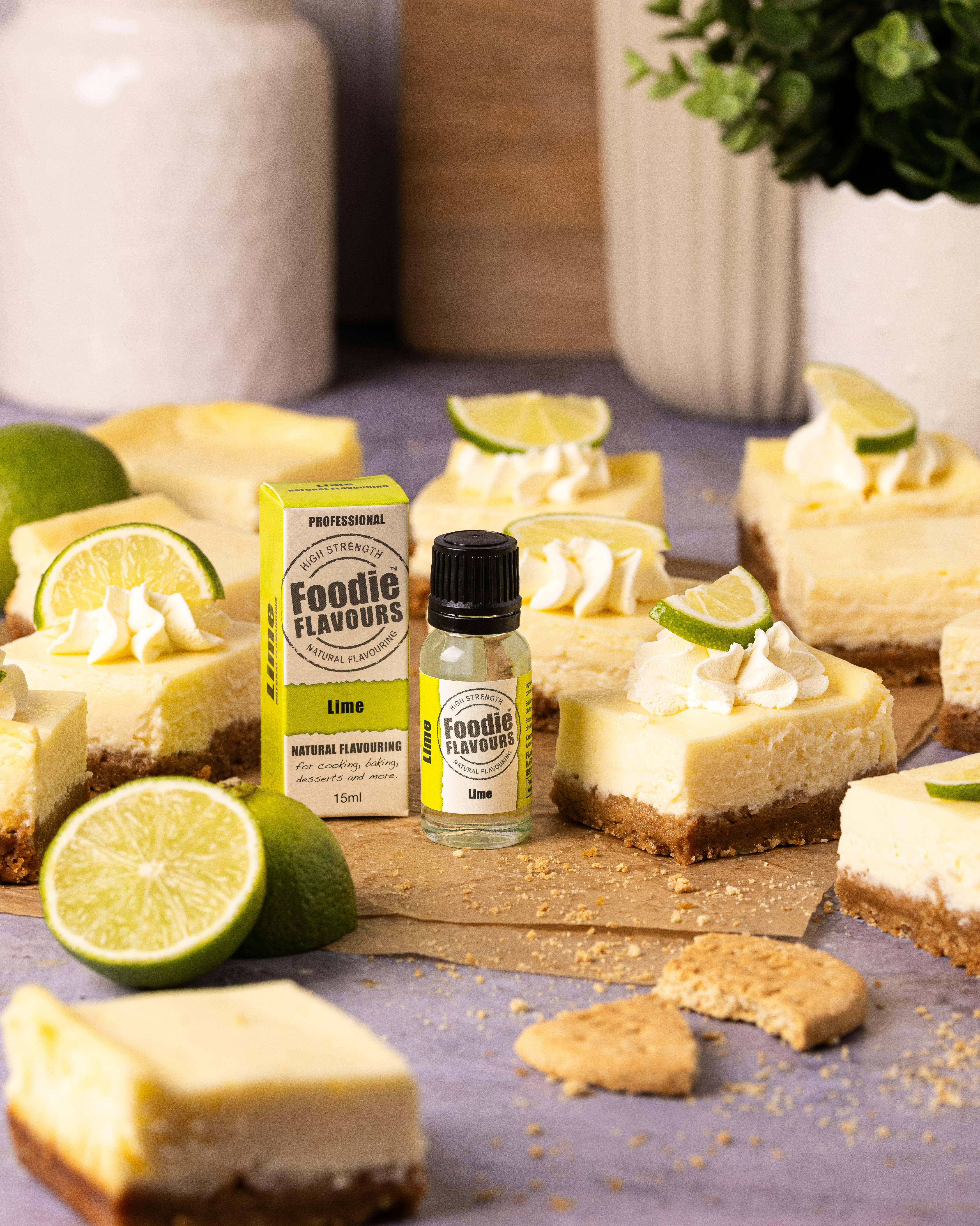 Lime cheesecakes with lime flavoring bottle.