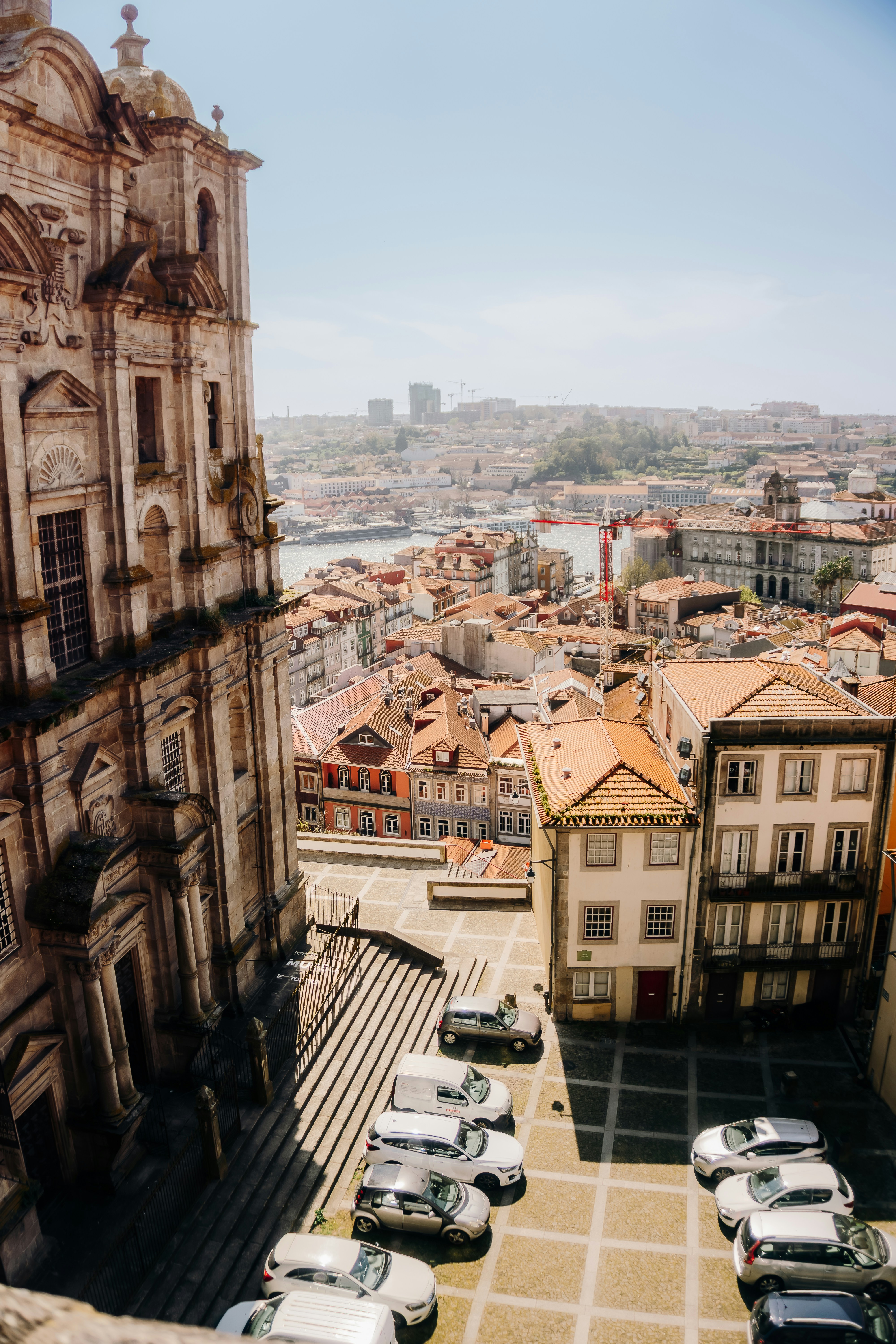 Ornate building overlooks a european city with a river.