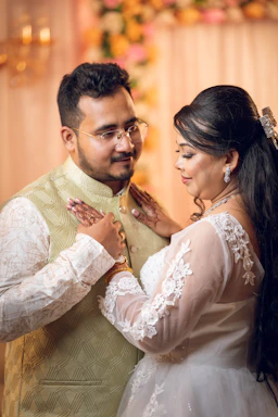 A bride and groom embracing during a wedding ceremony.