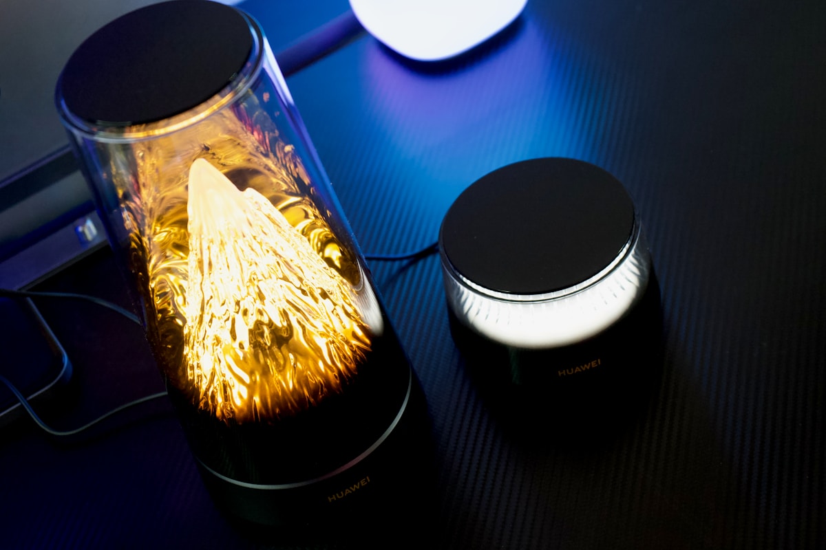 A glowing decorative lamp with a smaller light beside it.