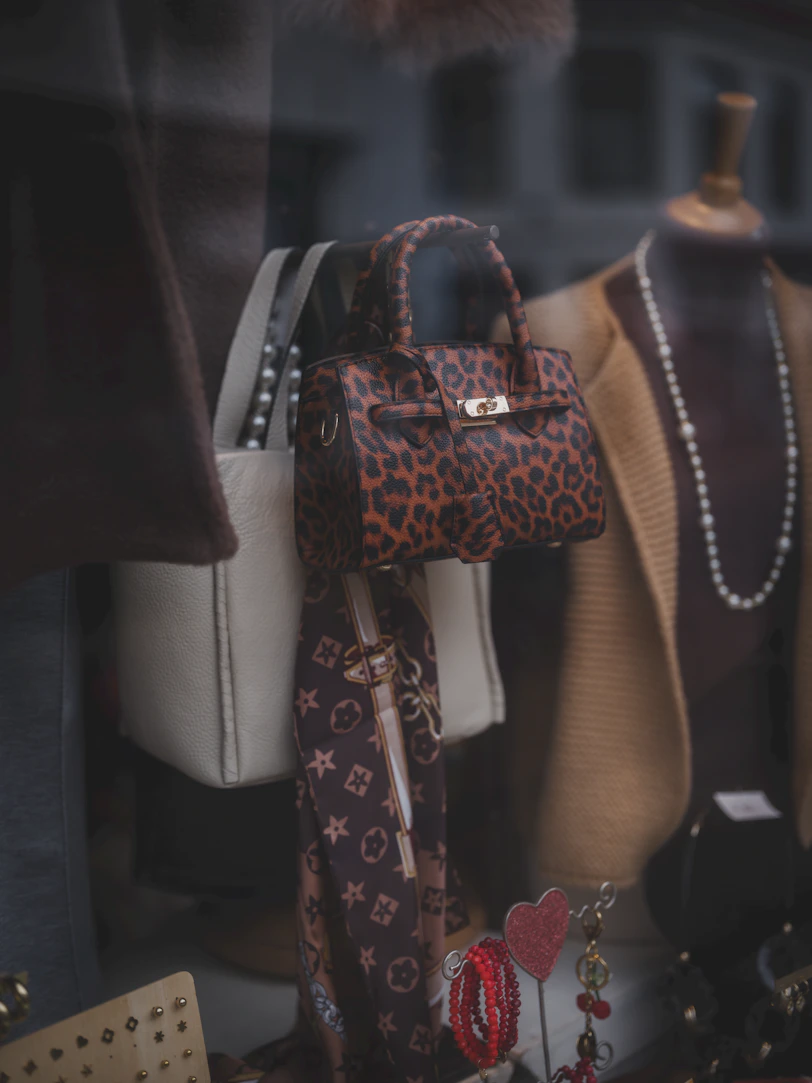 Leopard print handbag with accessories in a shop window