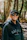 Woman wearing a canada hoodie and sunglasses in woods
