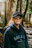 Woman wearing a canada hoodie and sunglasses in woods