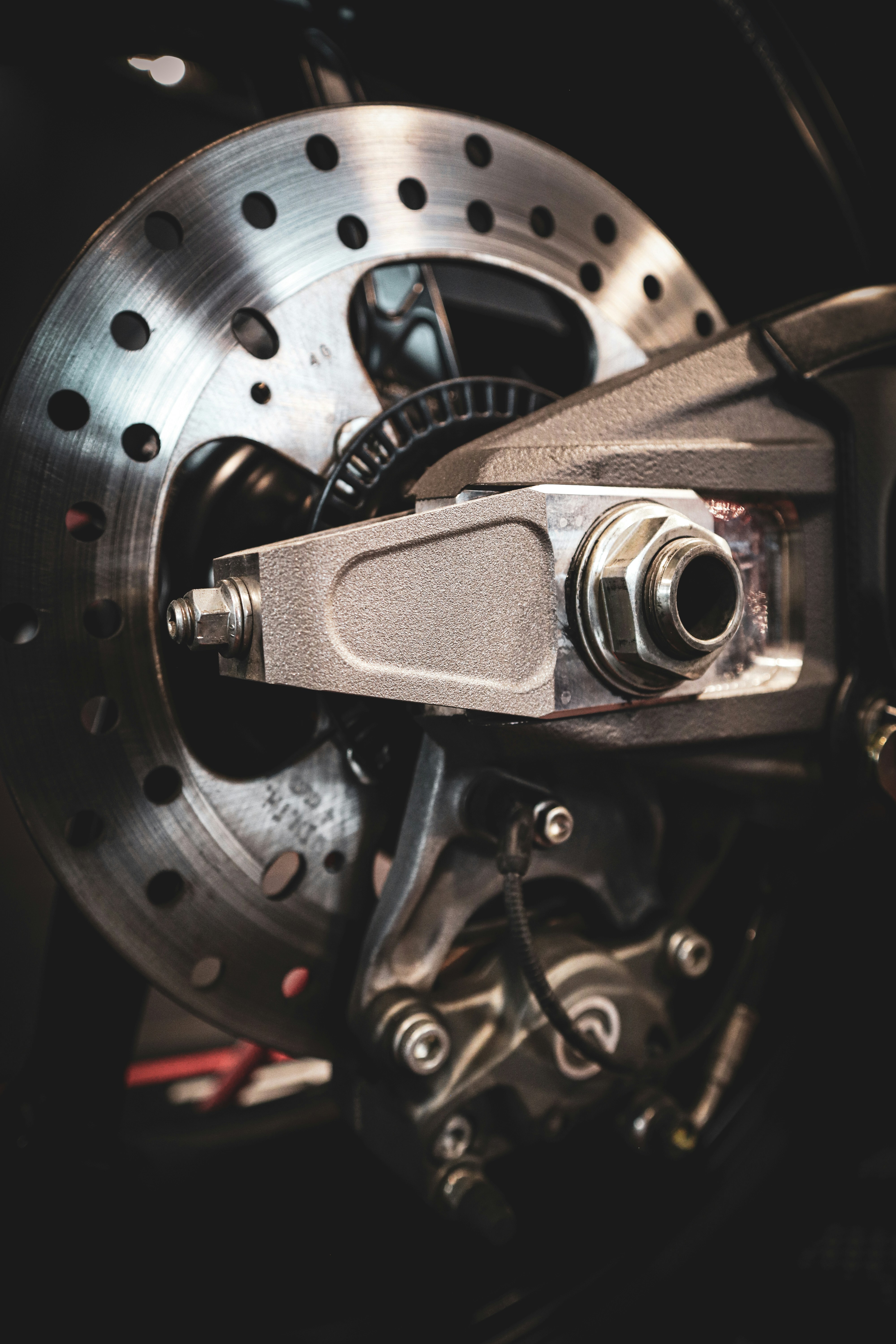 Close-up of a motorcycle brake disc and caliper