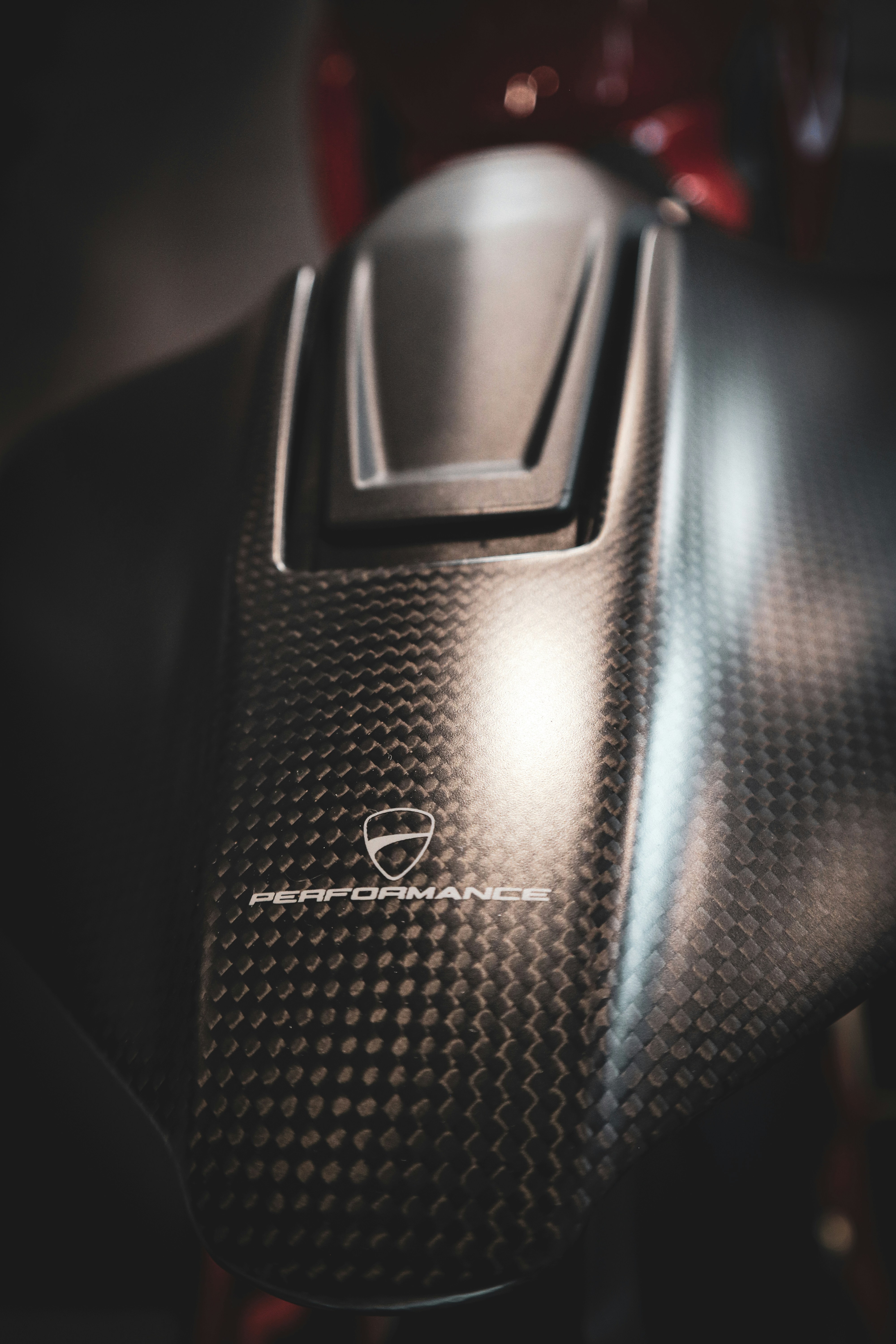 Close-up of a carbon fiber motorcycle fuel tank