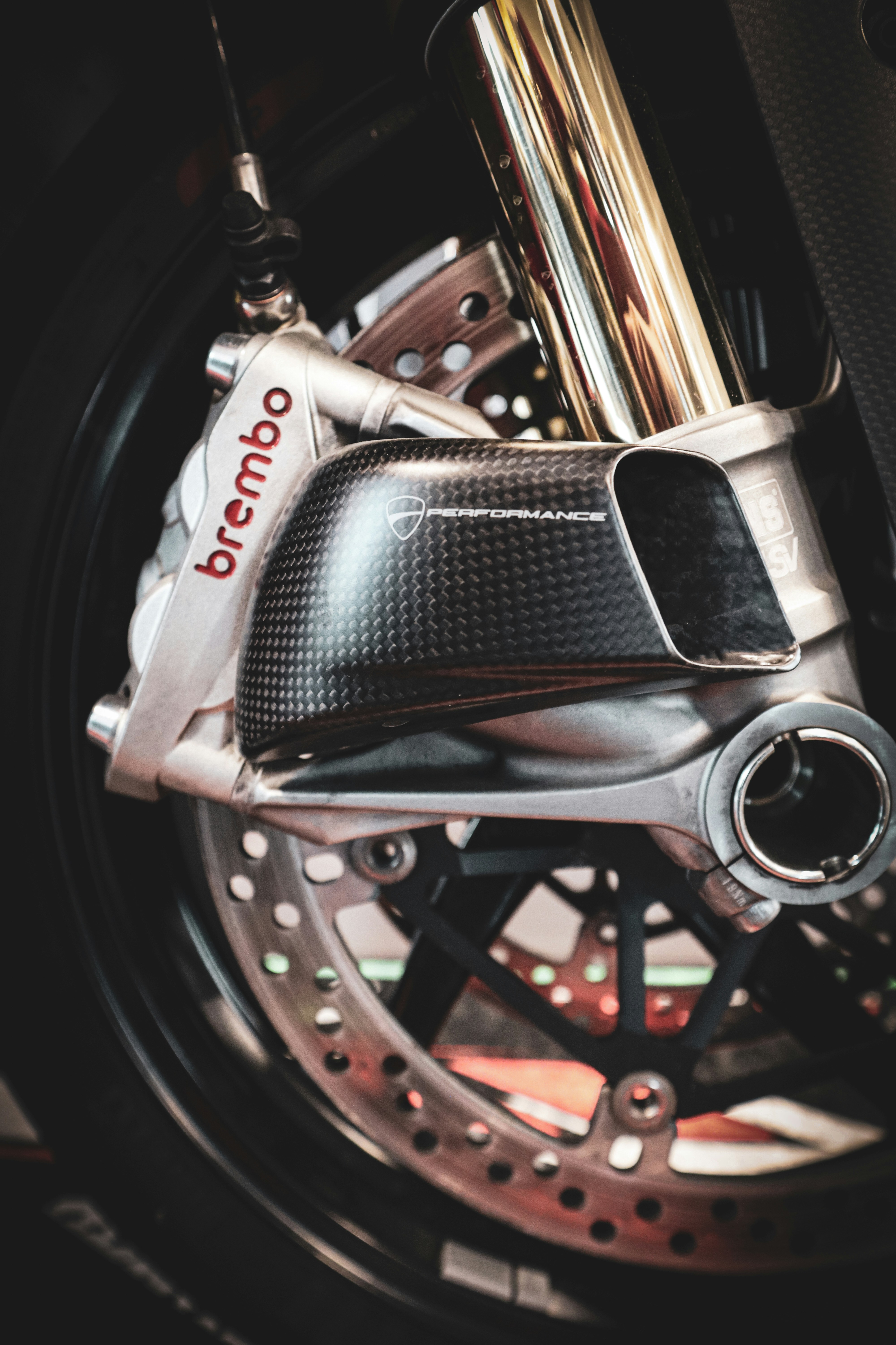 Close-up of a motorcycle's front brake system.