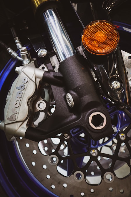 Close-up of a motorcycle brake caliper and rotor