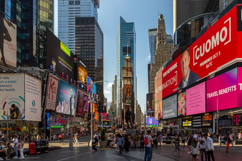 Times square with bright billboards and crowds of people