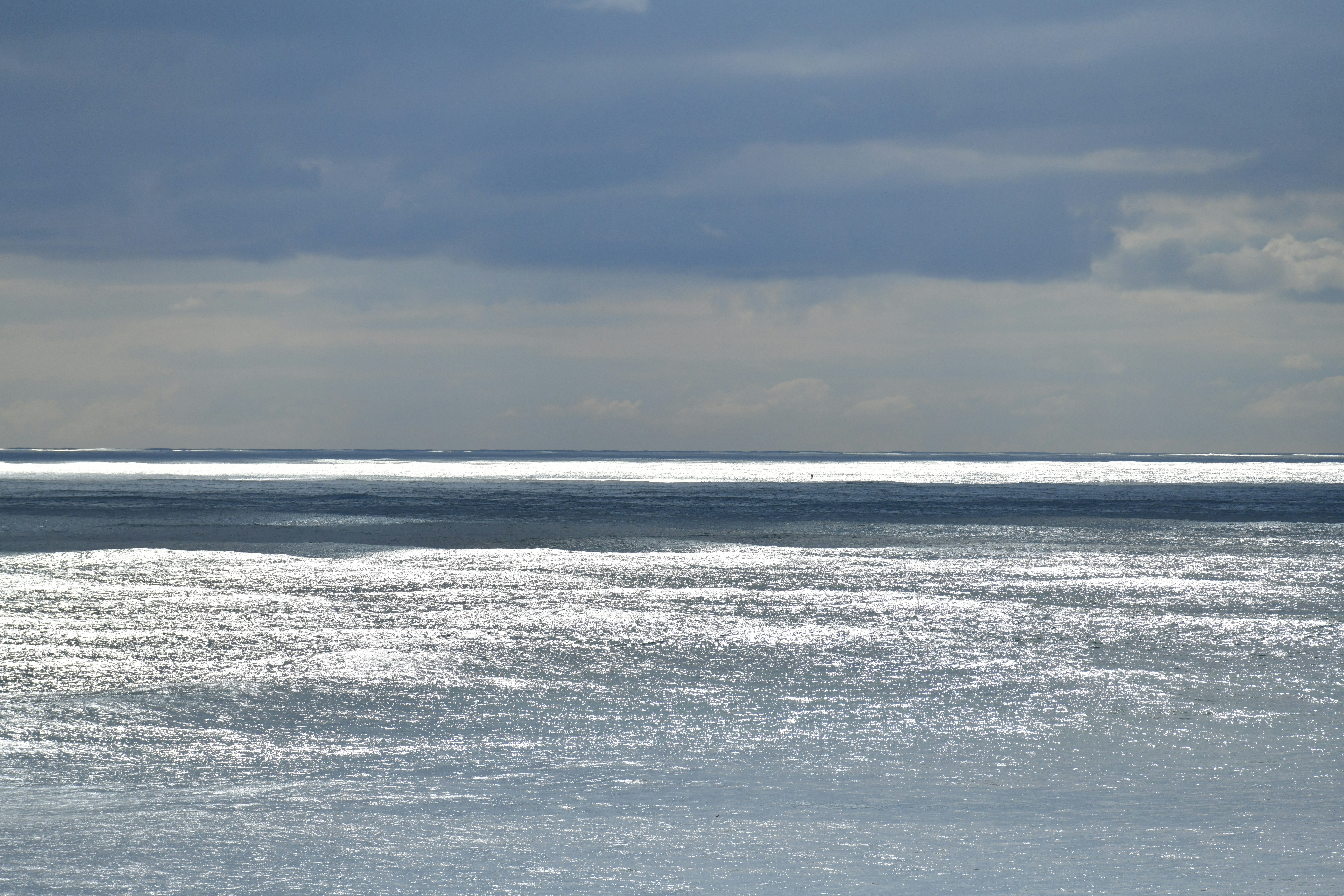 Sunlight glinting on the surface of a calm sea.