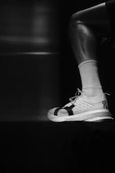 Close-up of a runner's leg and athletic shoe