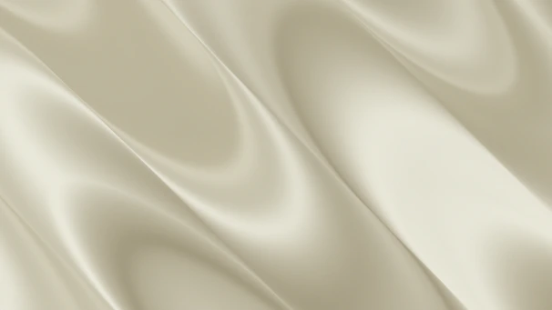 Soft, flowing, light beige fabric with elegant folds
