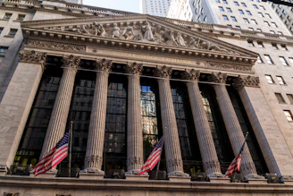 New york stock exchange building with american flags