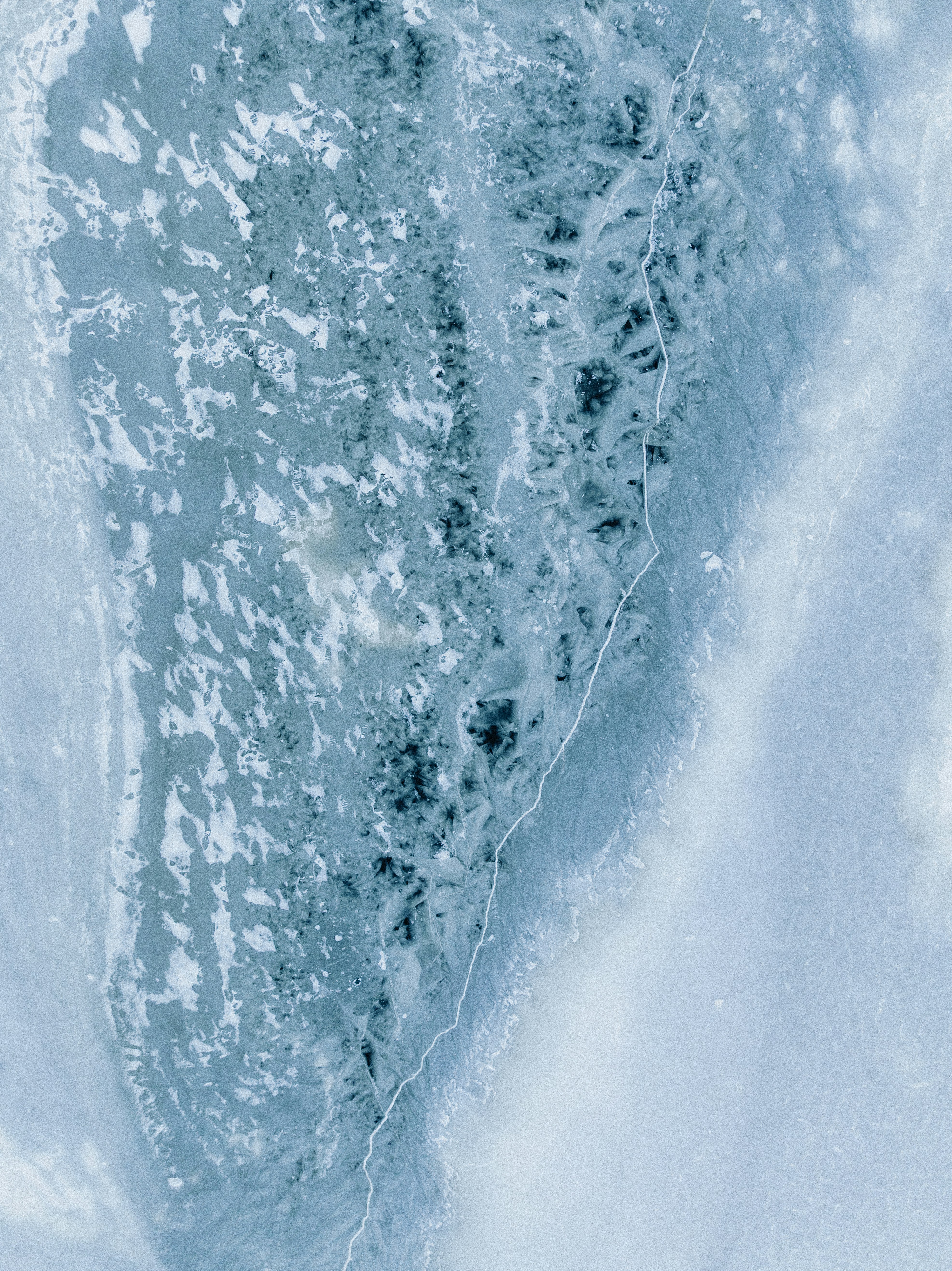 Abstract pattern of cracked ice and snow