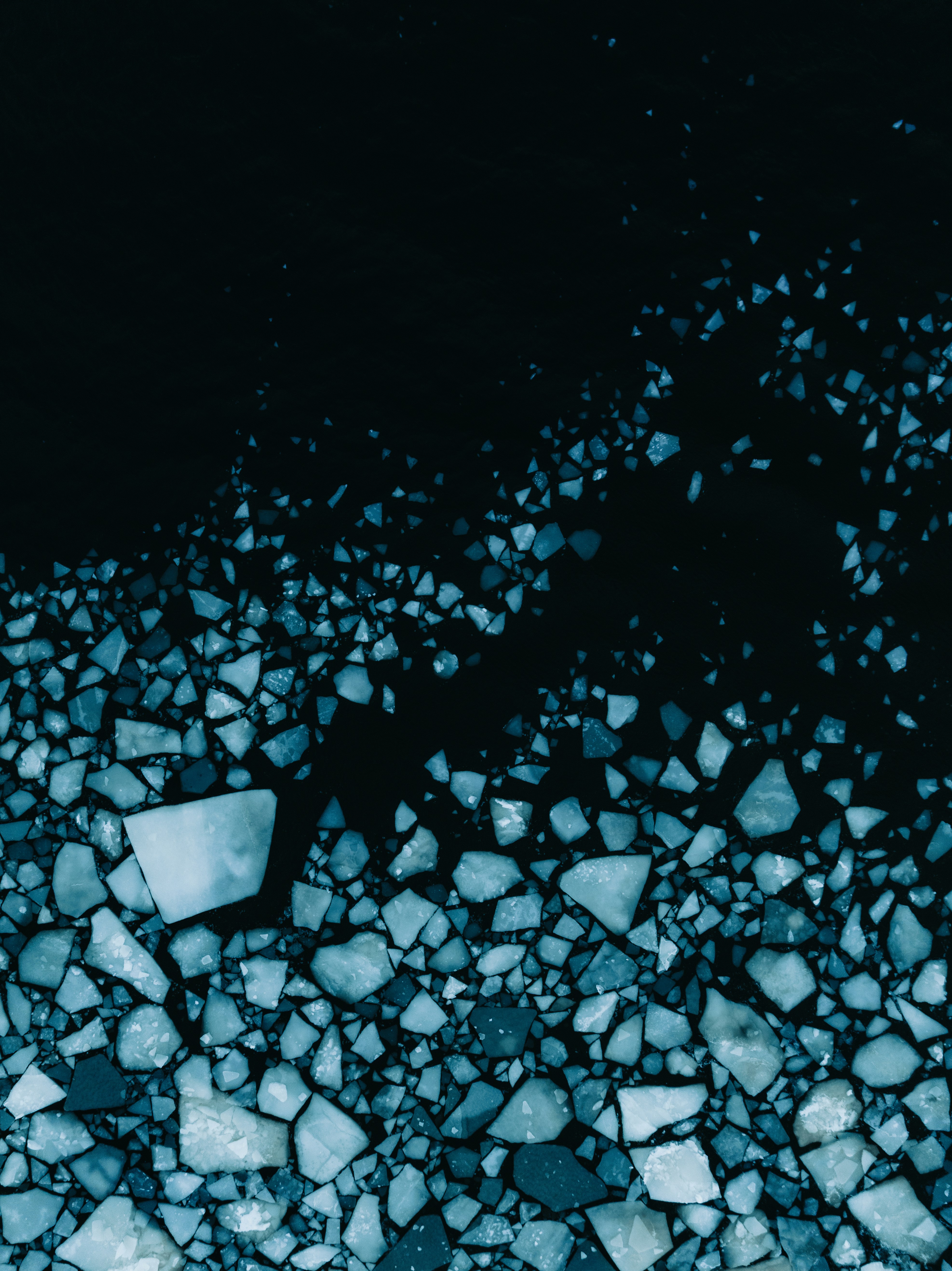 Ice floes scattered on dark water