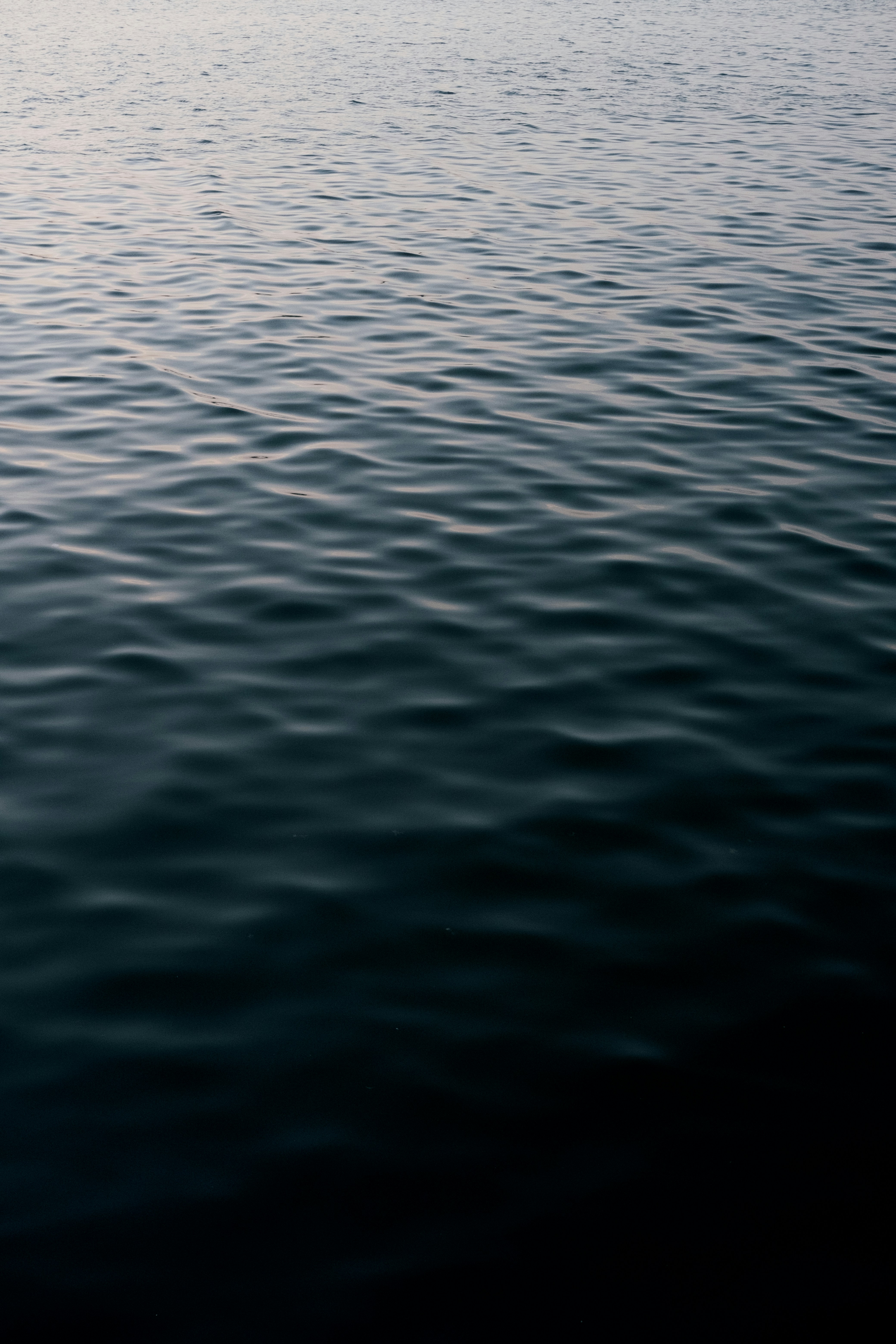 Dark blue water with gentle ripples