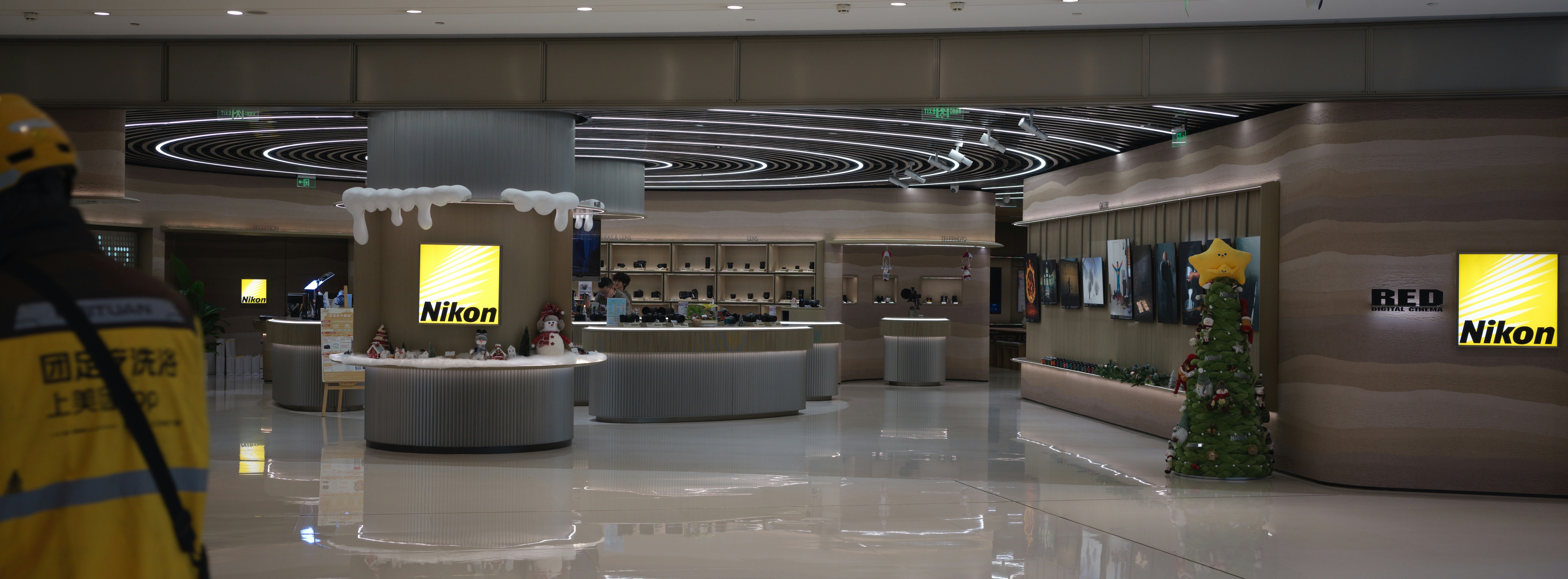 Modern nikon store interior with displays and lighting