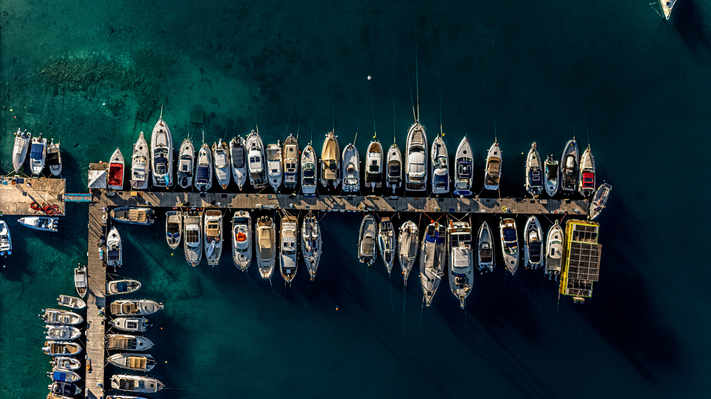 Aerial view of motor yachts berthed in a marina
