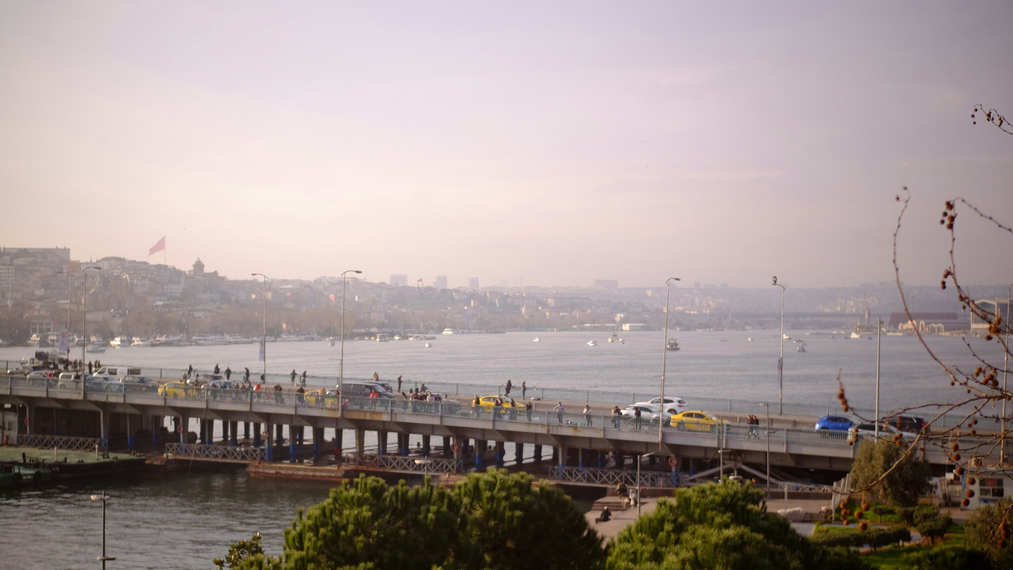 Bridge over water with city skyline in background