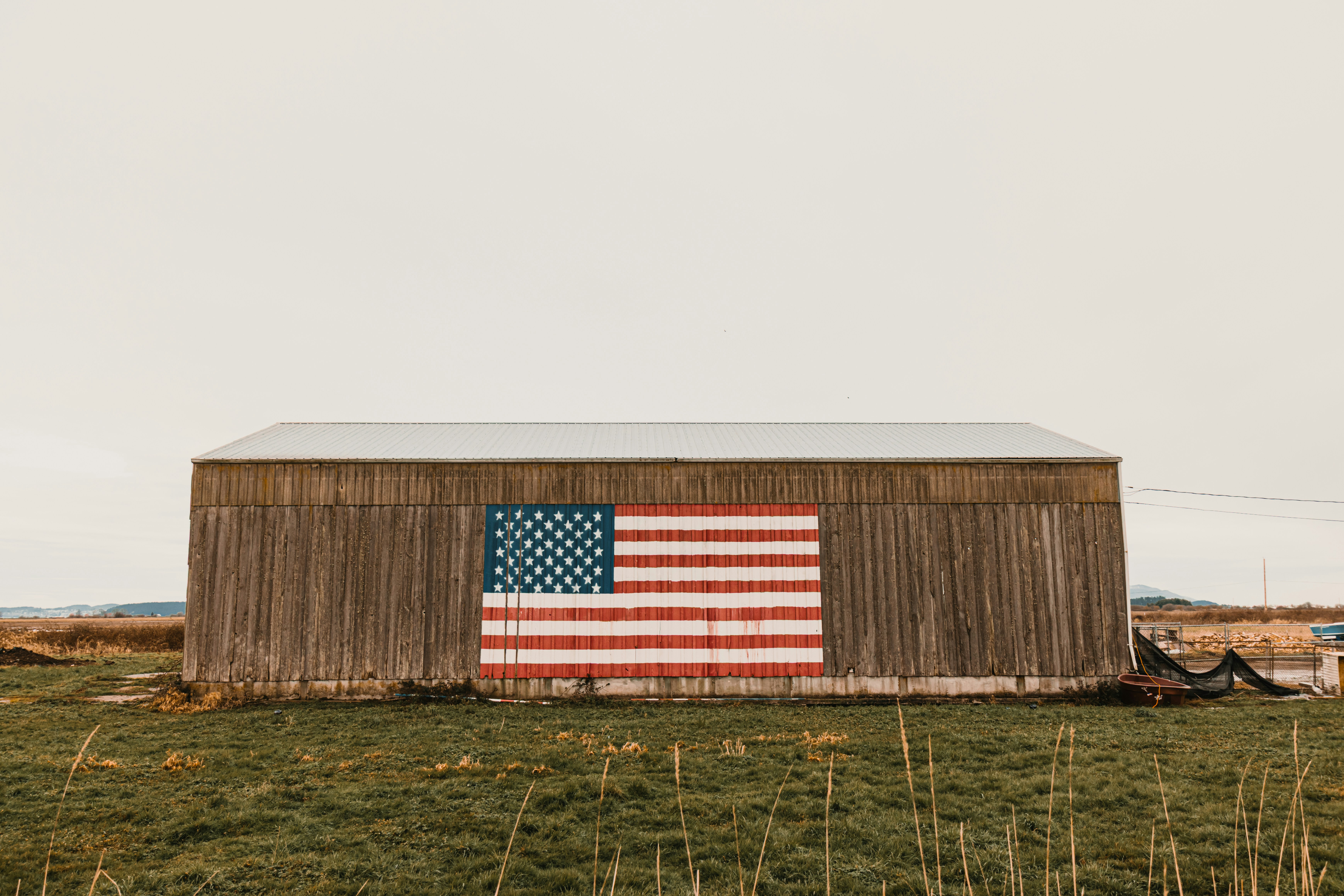 Barn with american flag painted on side