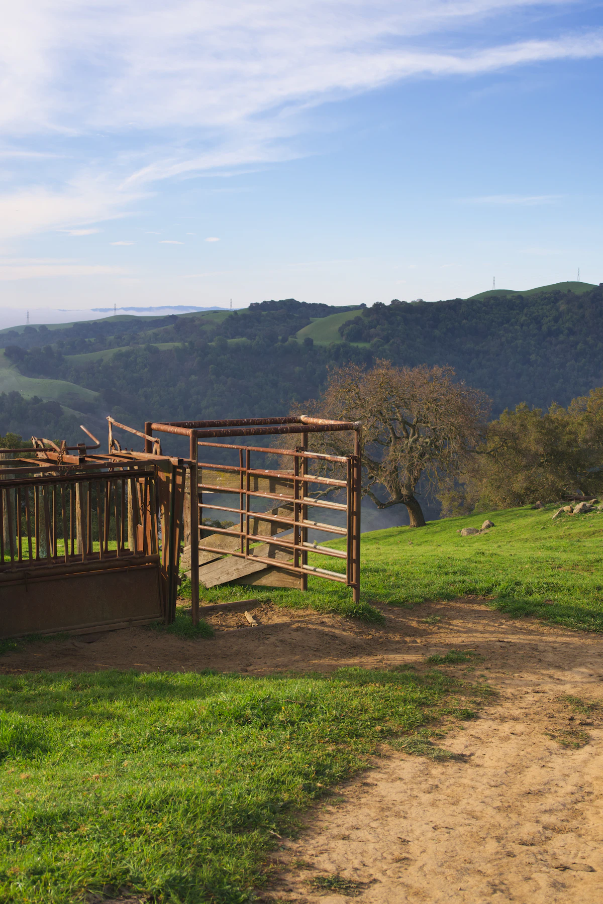 Rustic ranch gate on a grassy Sierra Foothills hillside near Penn Valley CA