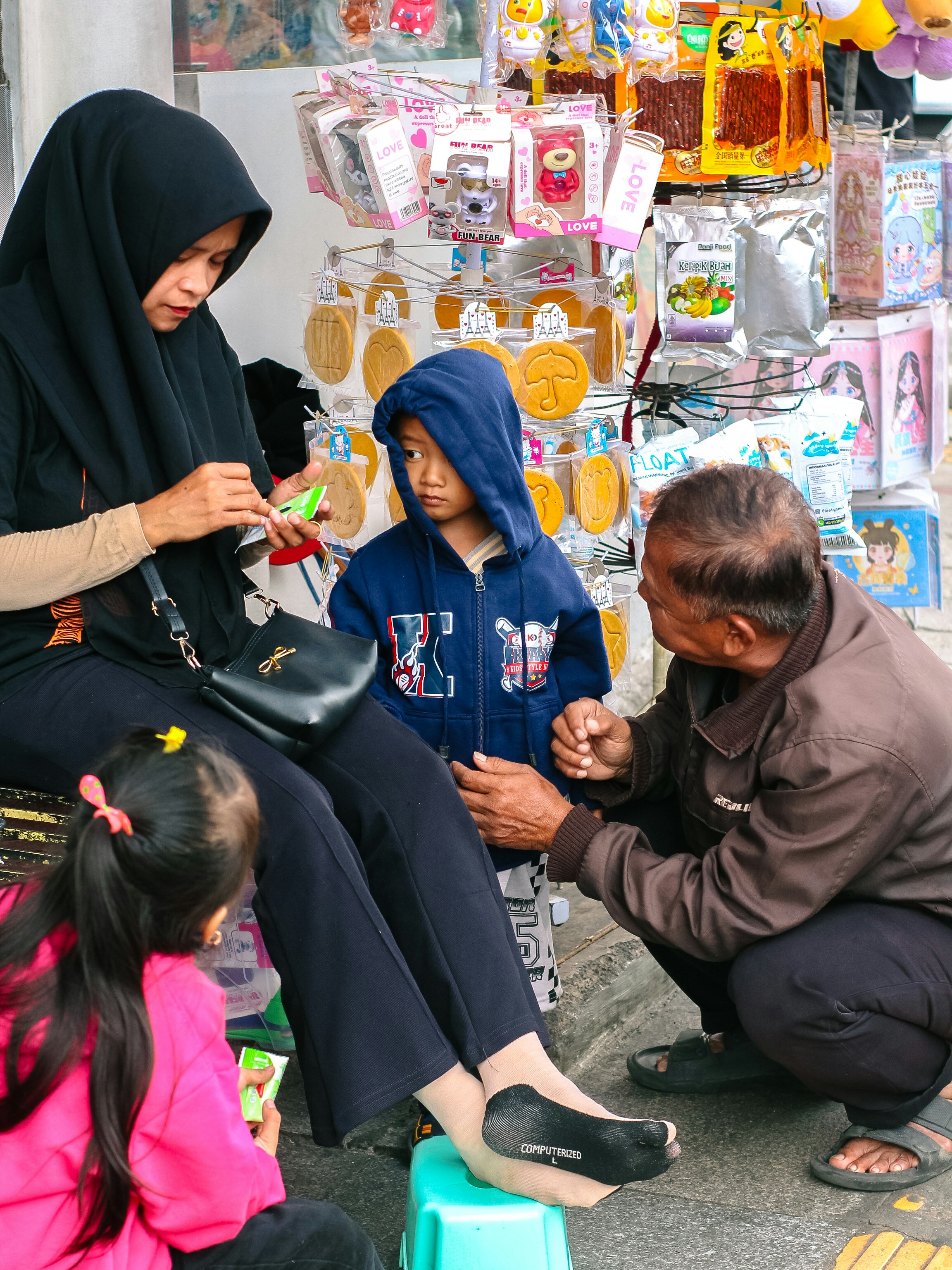 Family at a street stall with snacks