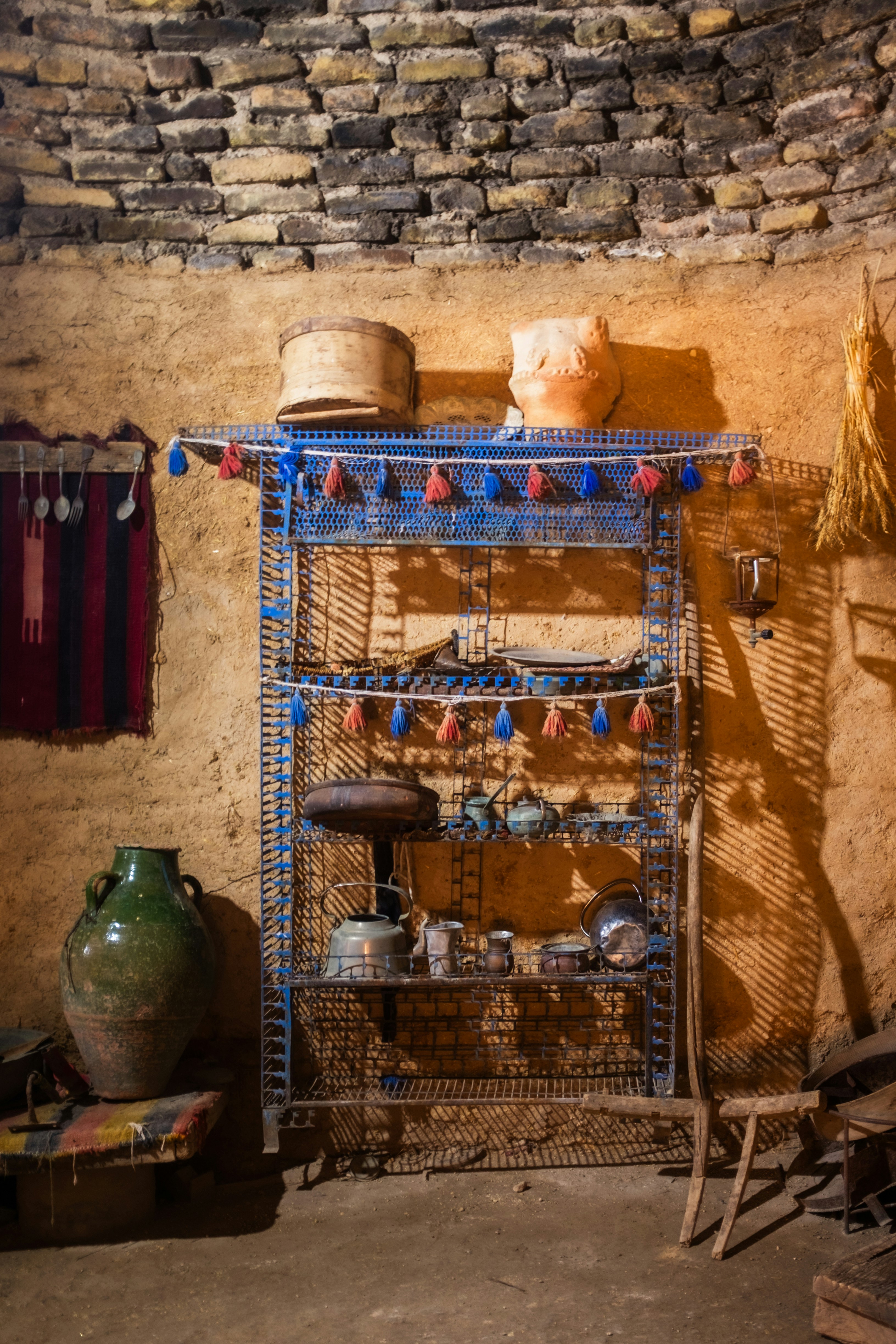 Rustic shelving unit with pottery and woven items