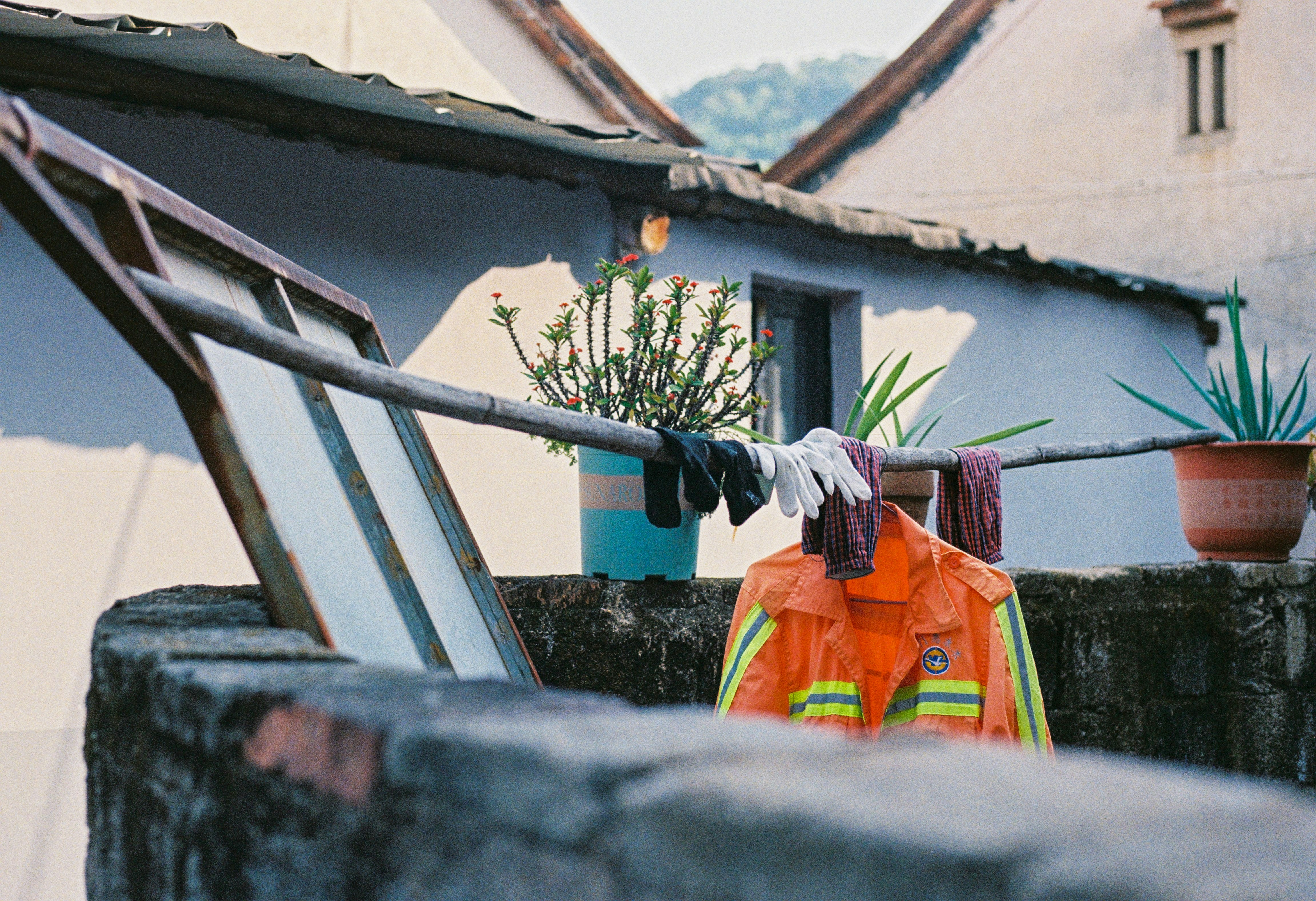Orange jacket and clothes drying on a line