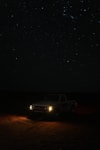 pickup truck under starry night sky