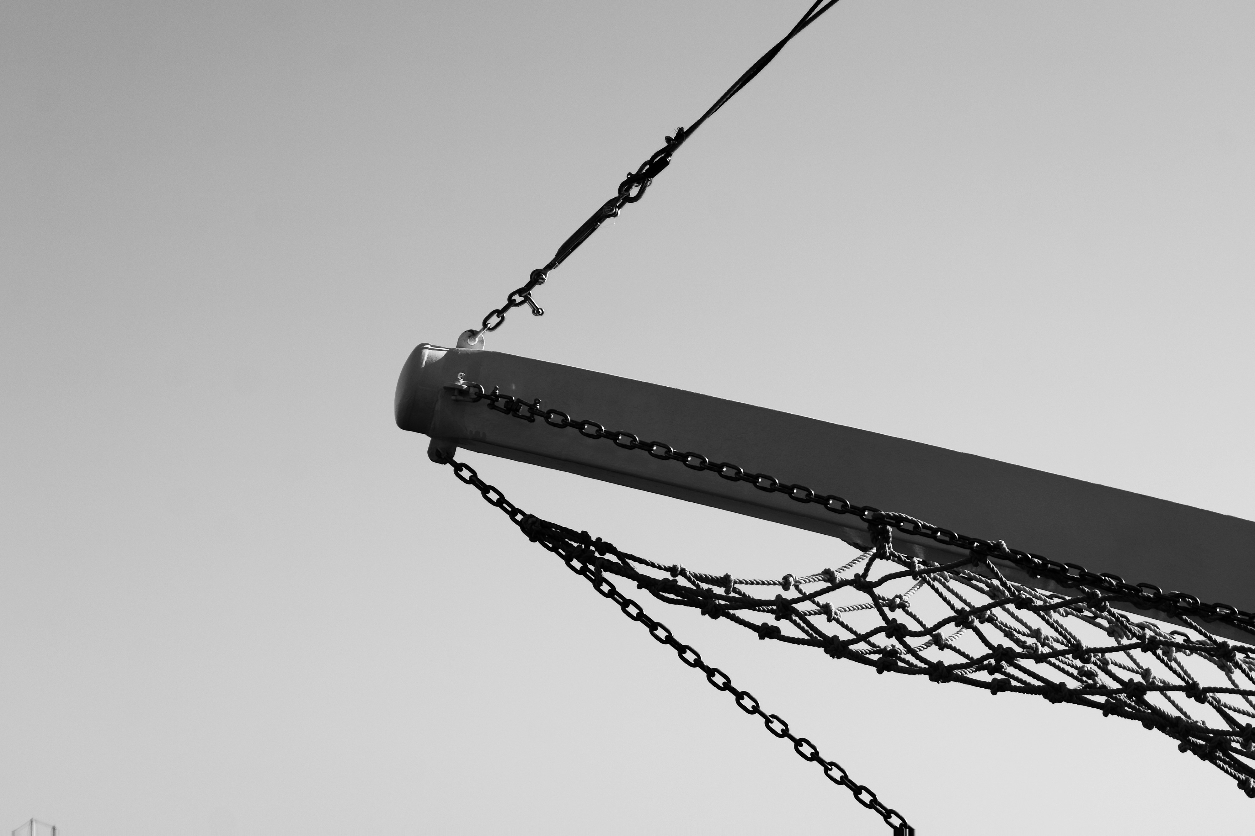 Close-up of a metal structure with chains and netting