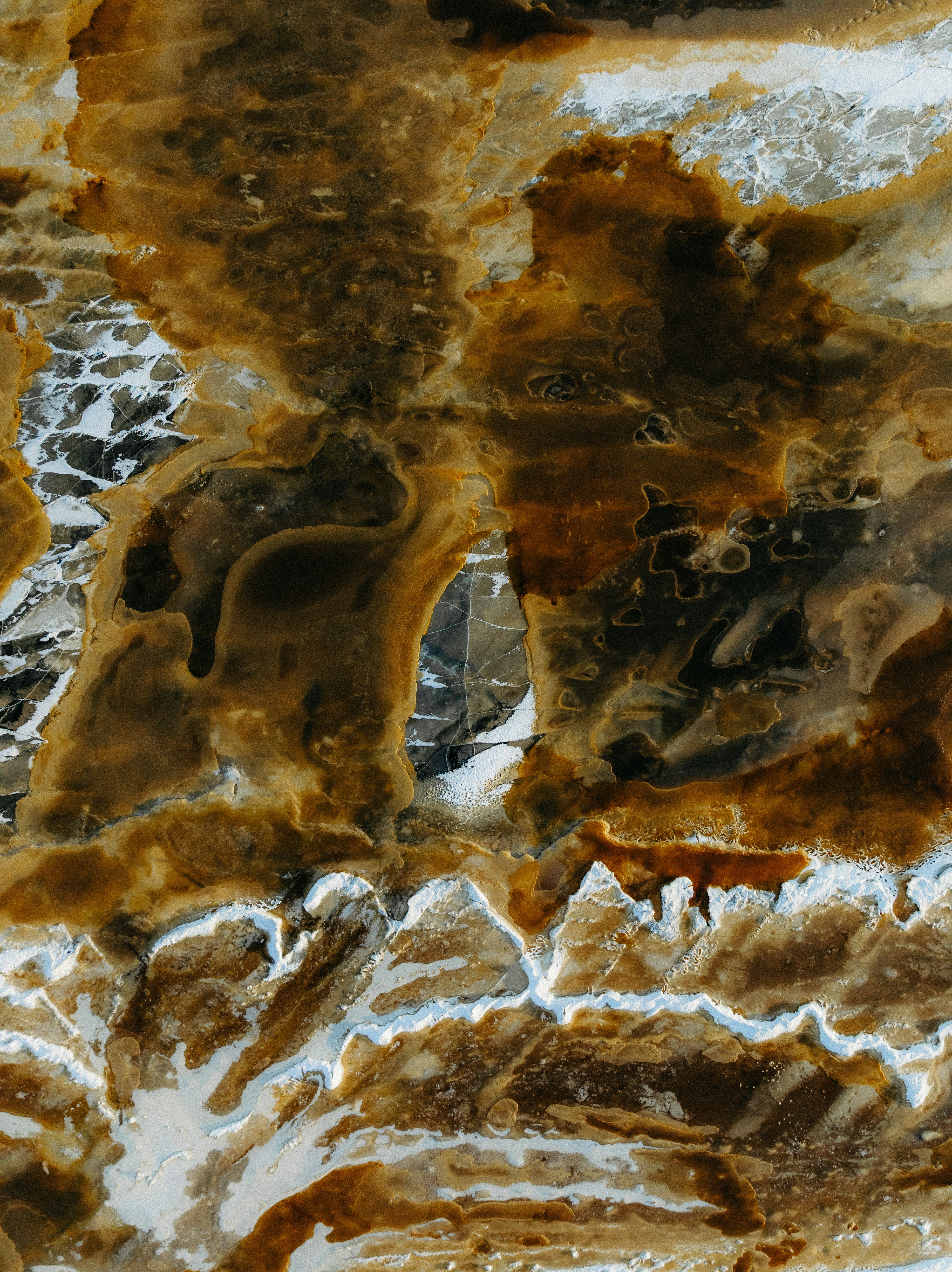 Abstract pattern of brown, white, and black textures