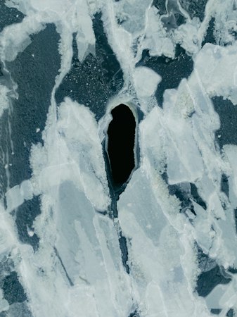 Cracked ice with a dark hole in the center