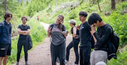 Group of friends hiking on a forest trail