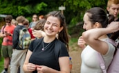 Young woman smiling with friends on a hike