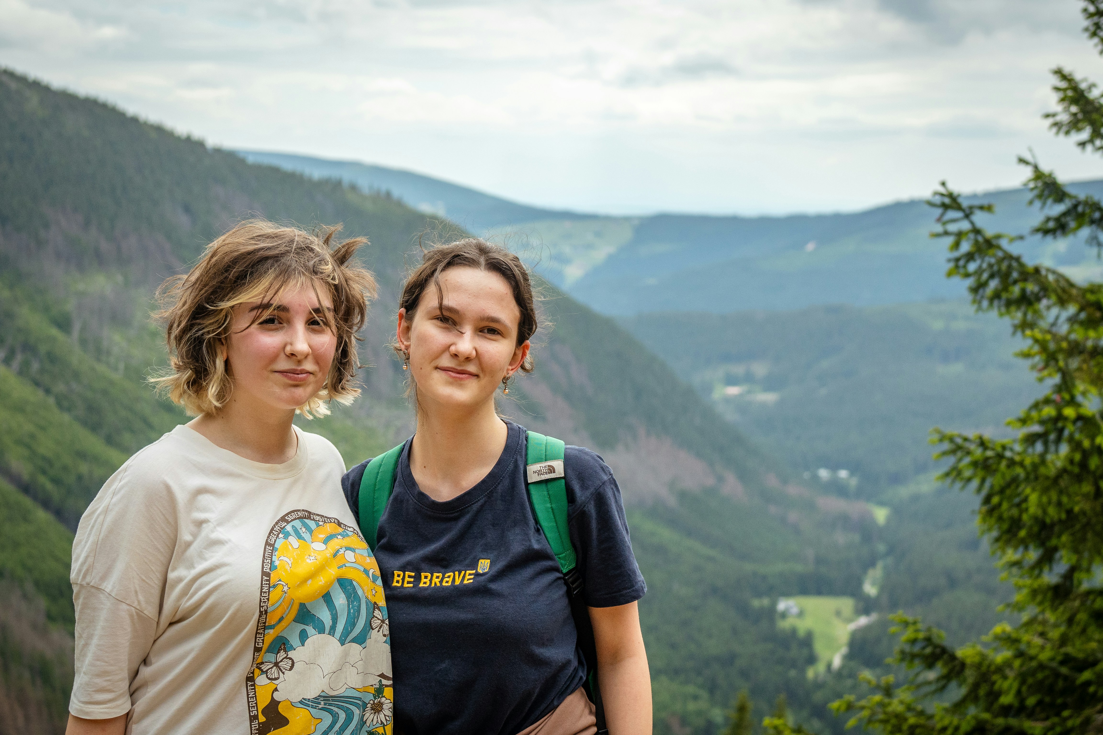 Two young women in a mountainous landscape
