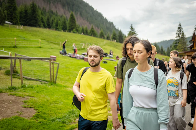 A group of hikers gathered on an outdoor trail