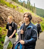 Young people hiking on a wooded trail