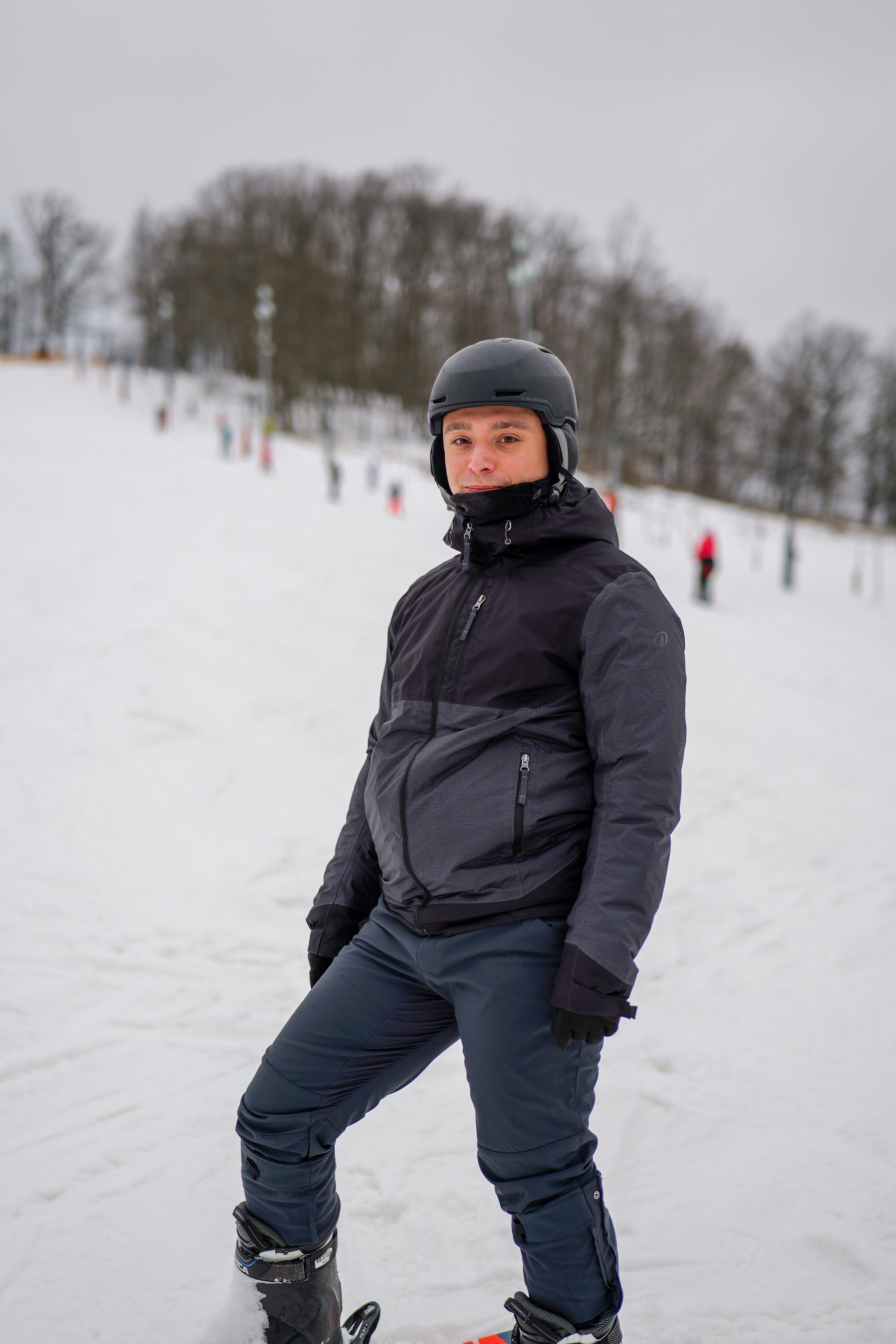 A person in ski gear on a snowy slope