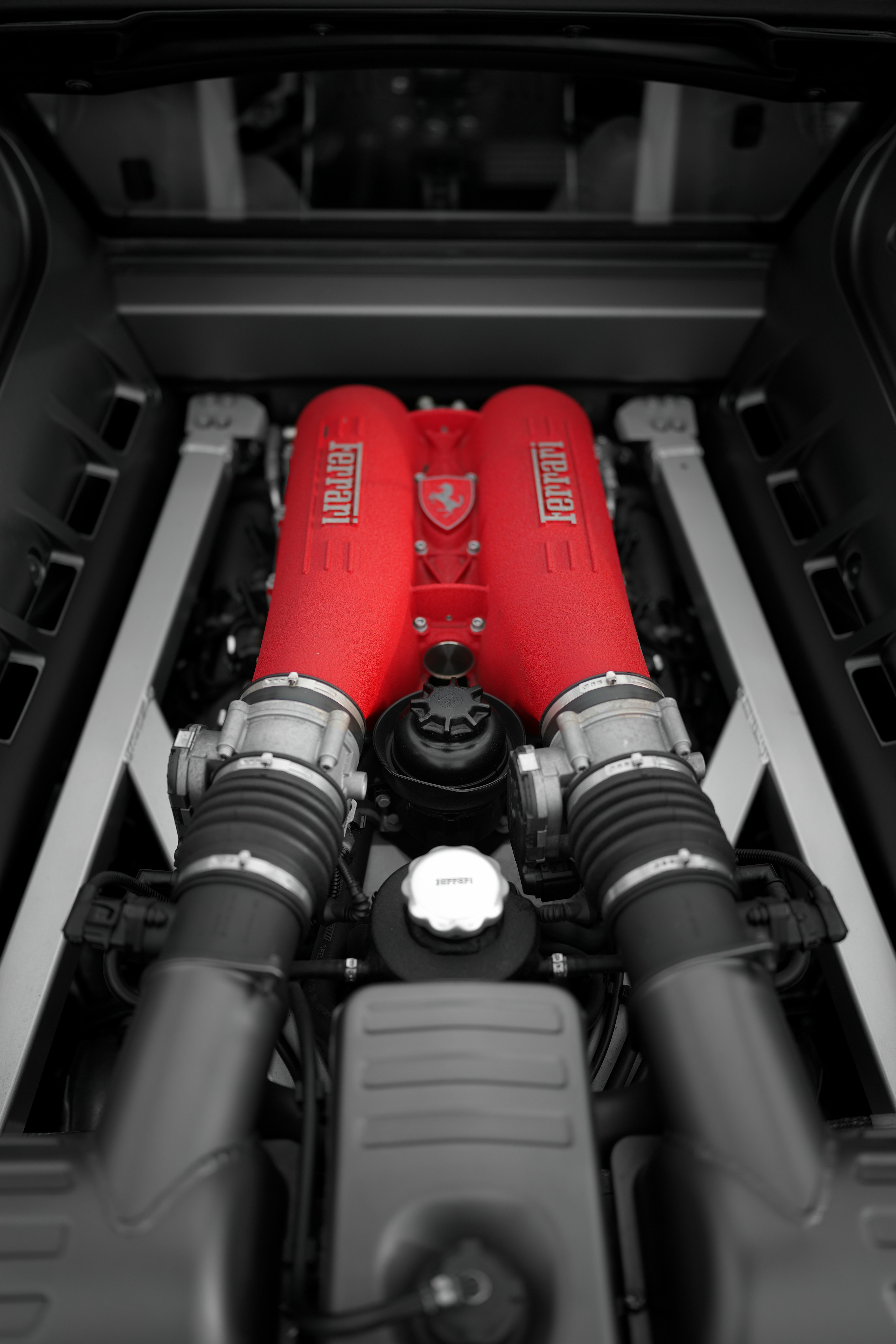 Red ferrari engine in a car