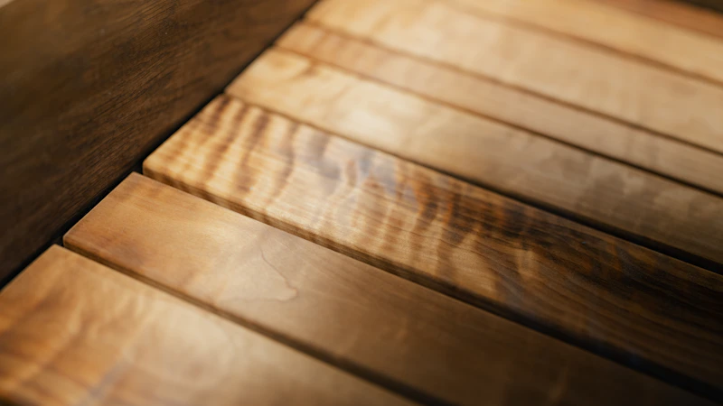 Workshop craftsman selecting hardwood lumber for a custom commission