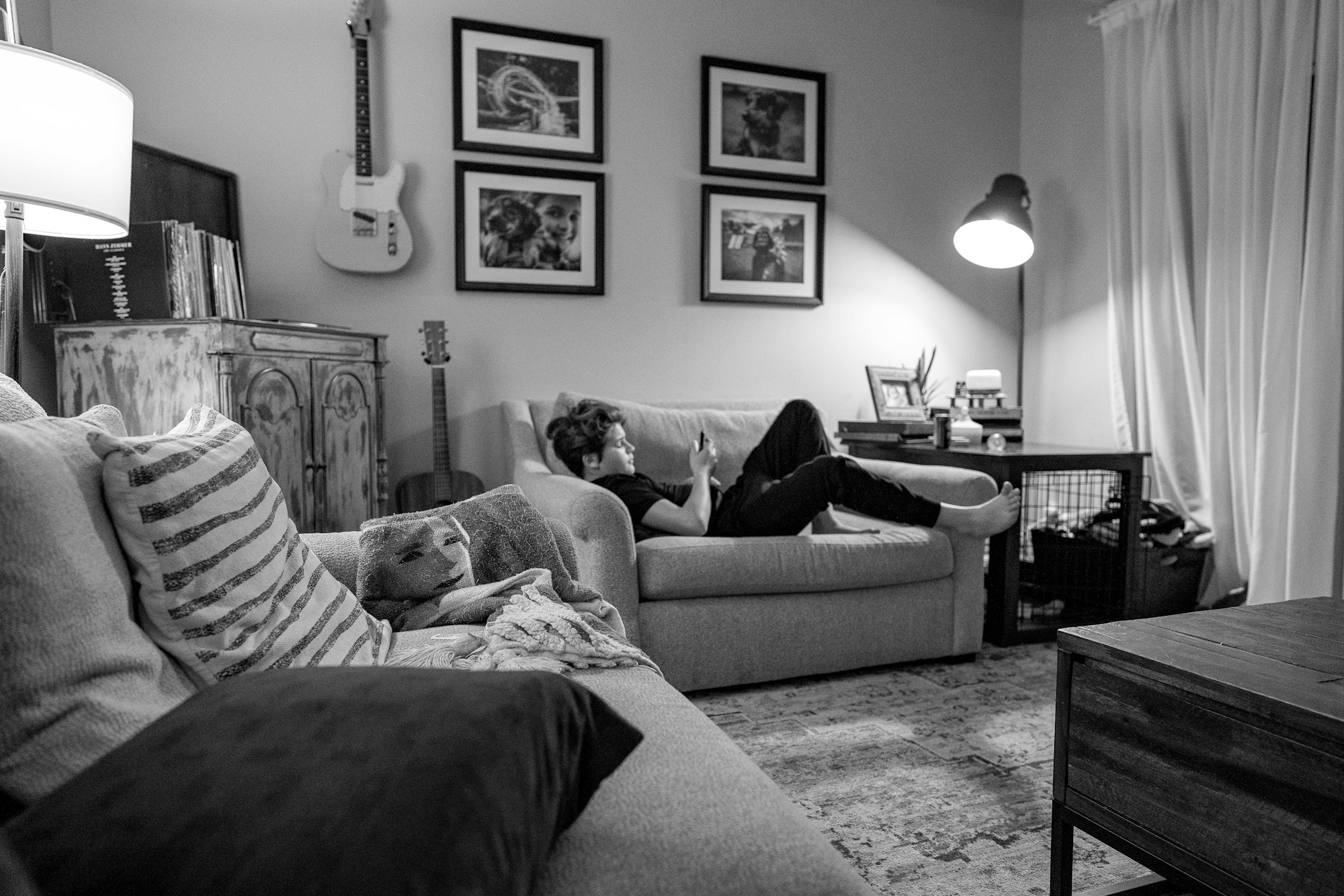 Woman relaxing on a couch at home in conversation