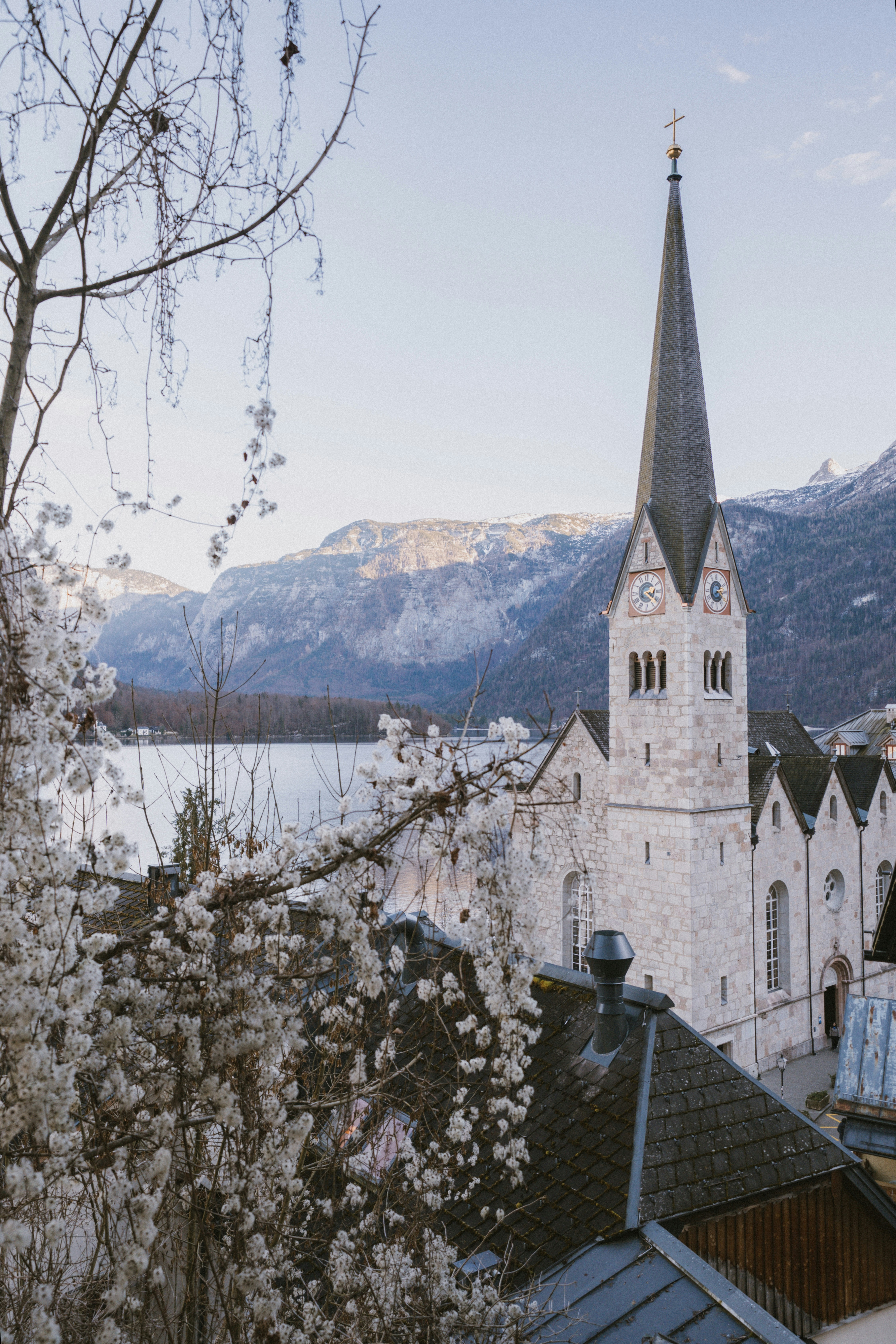 A picturesque european village with a tall church steeple.