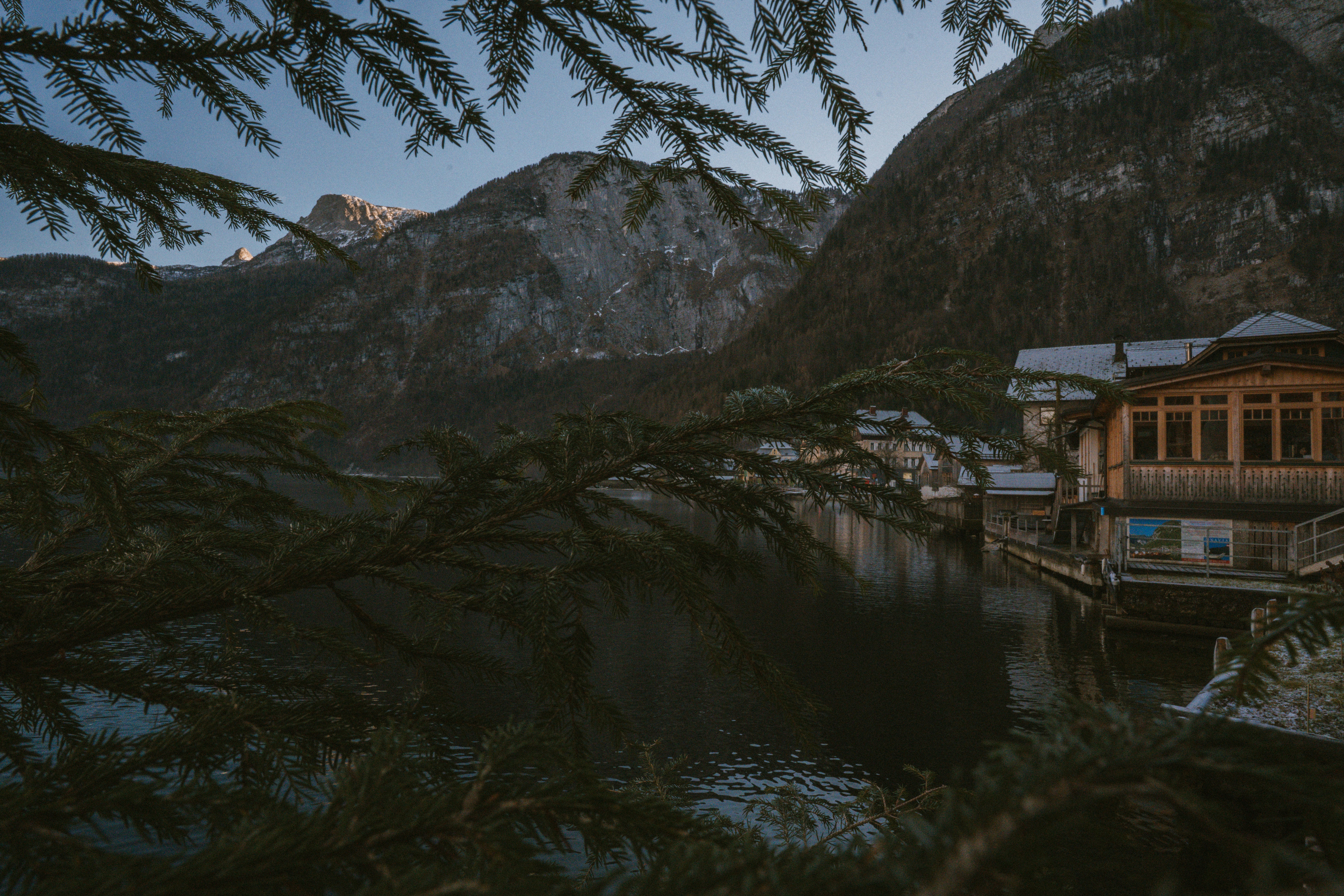 Mountain village on a calm lake at dusk