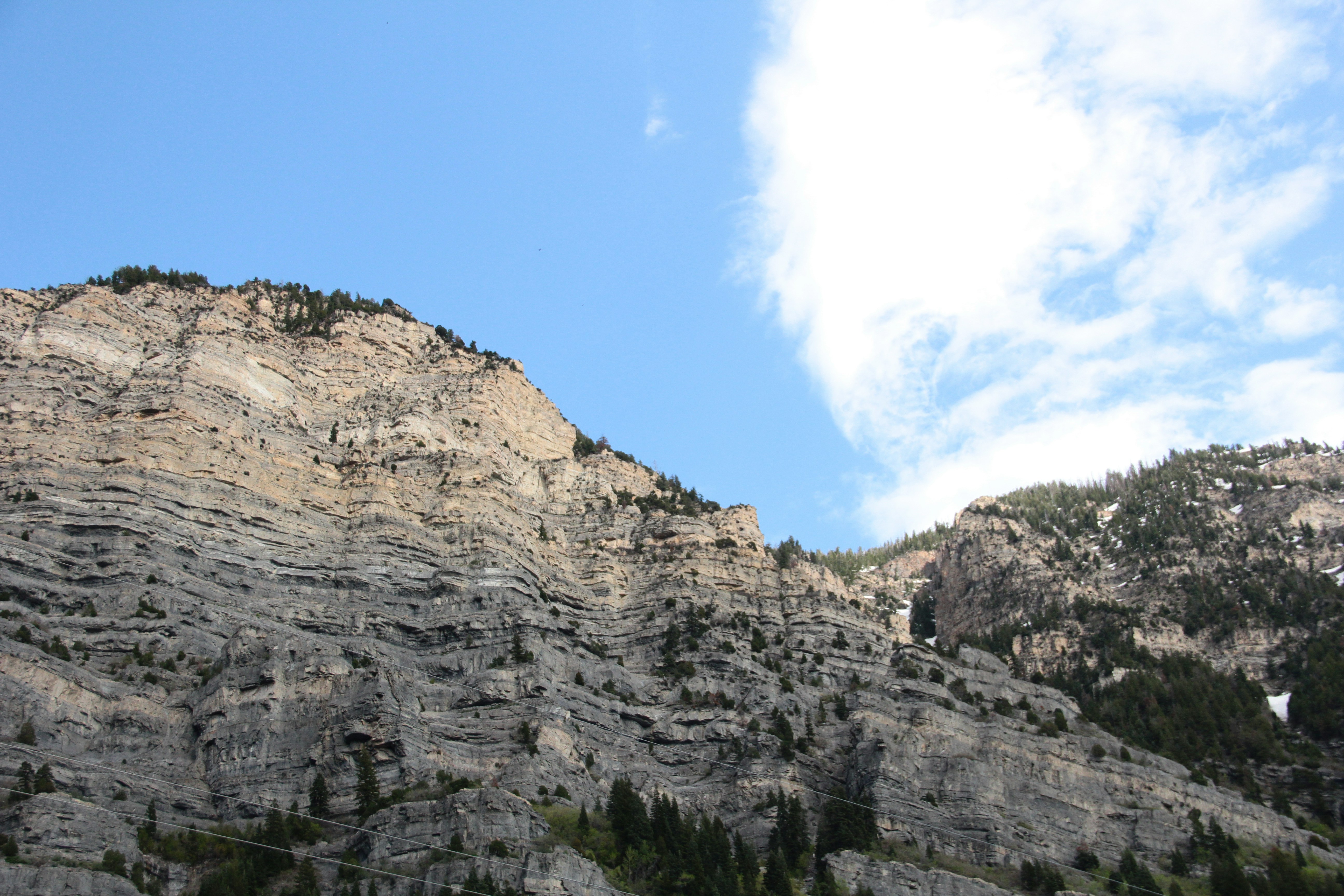 Jagged mountain range under a clear blue sky.