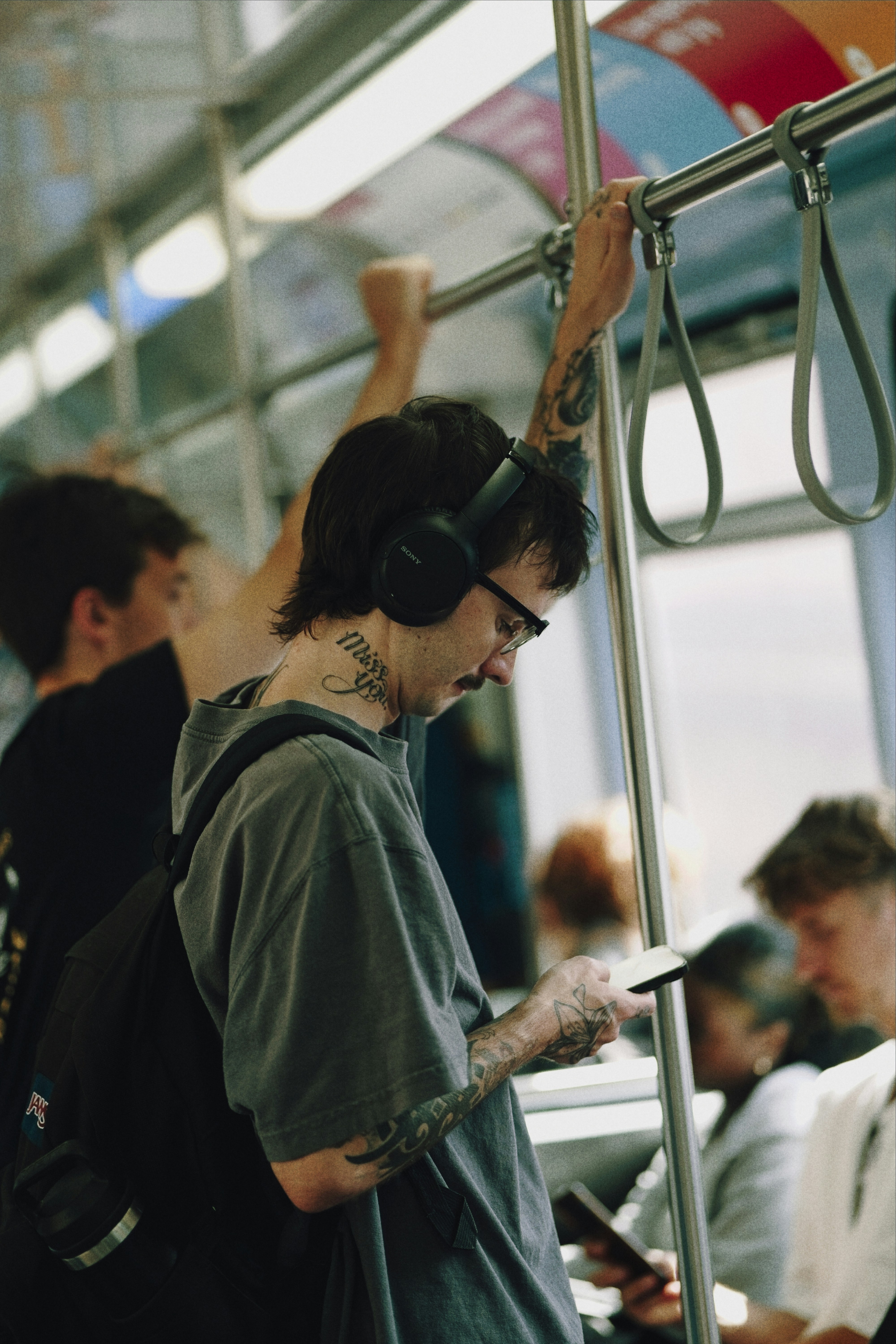 Man wearing headphones on public transport