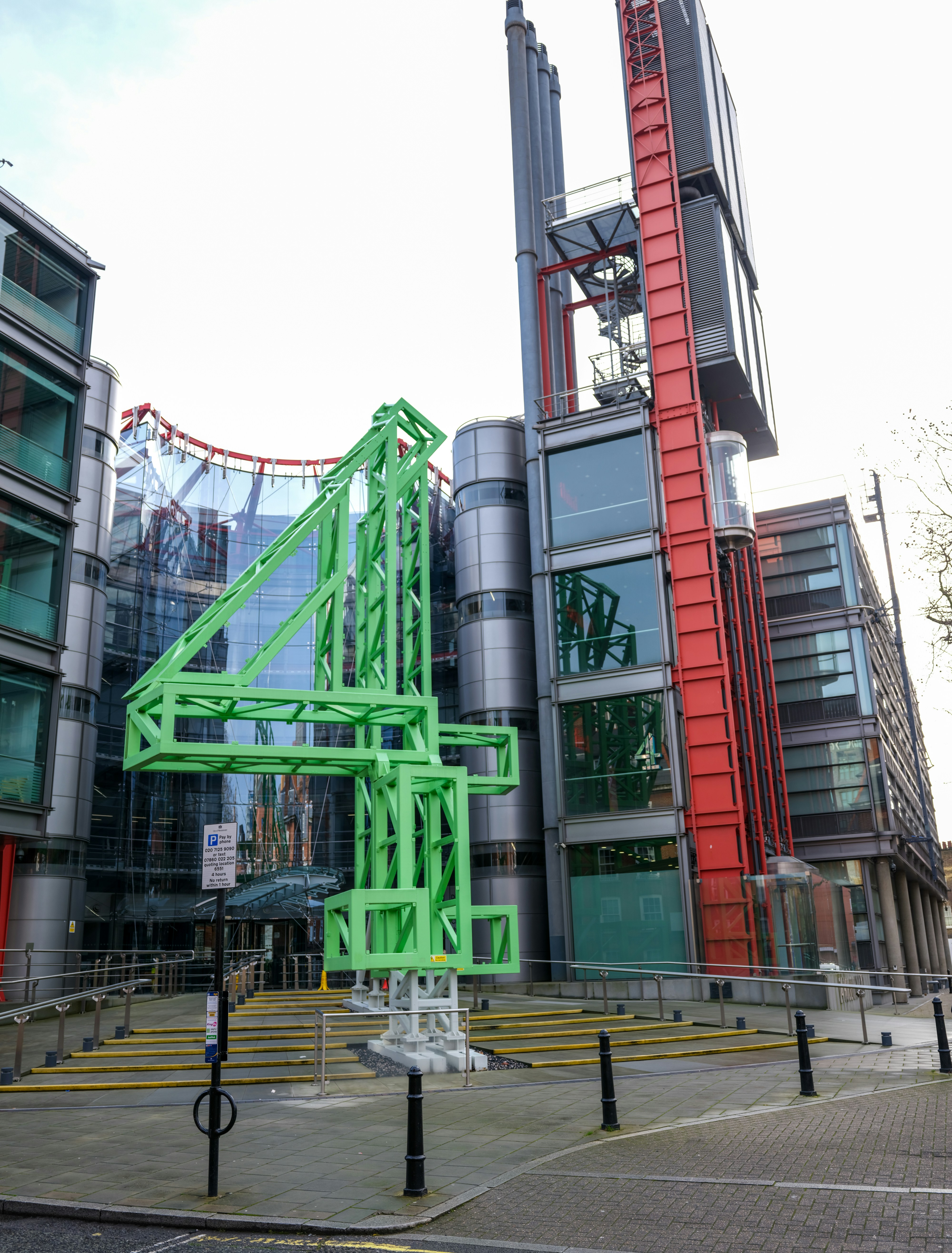 Modern building with a large green abstract sculpture