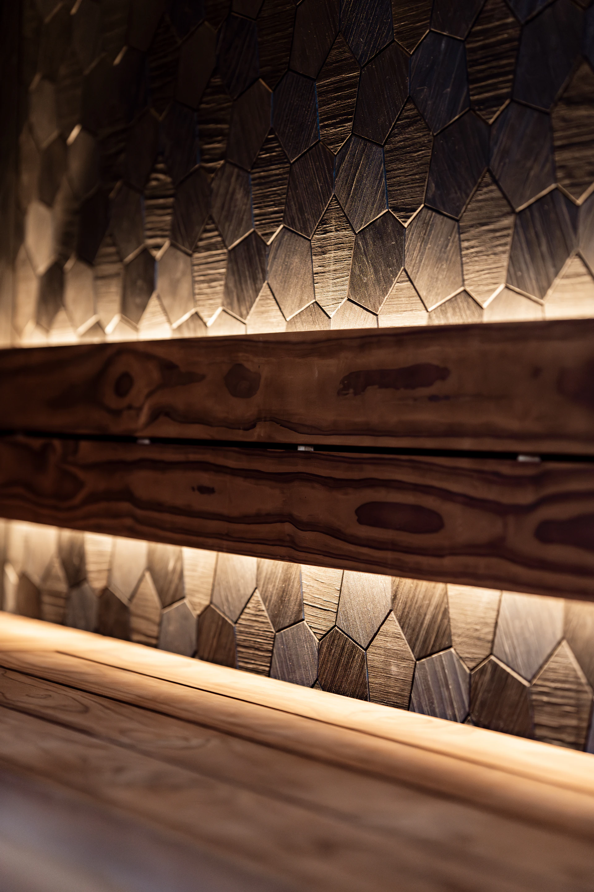 Wooden wall with geometric pattern and warm lighting