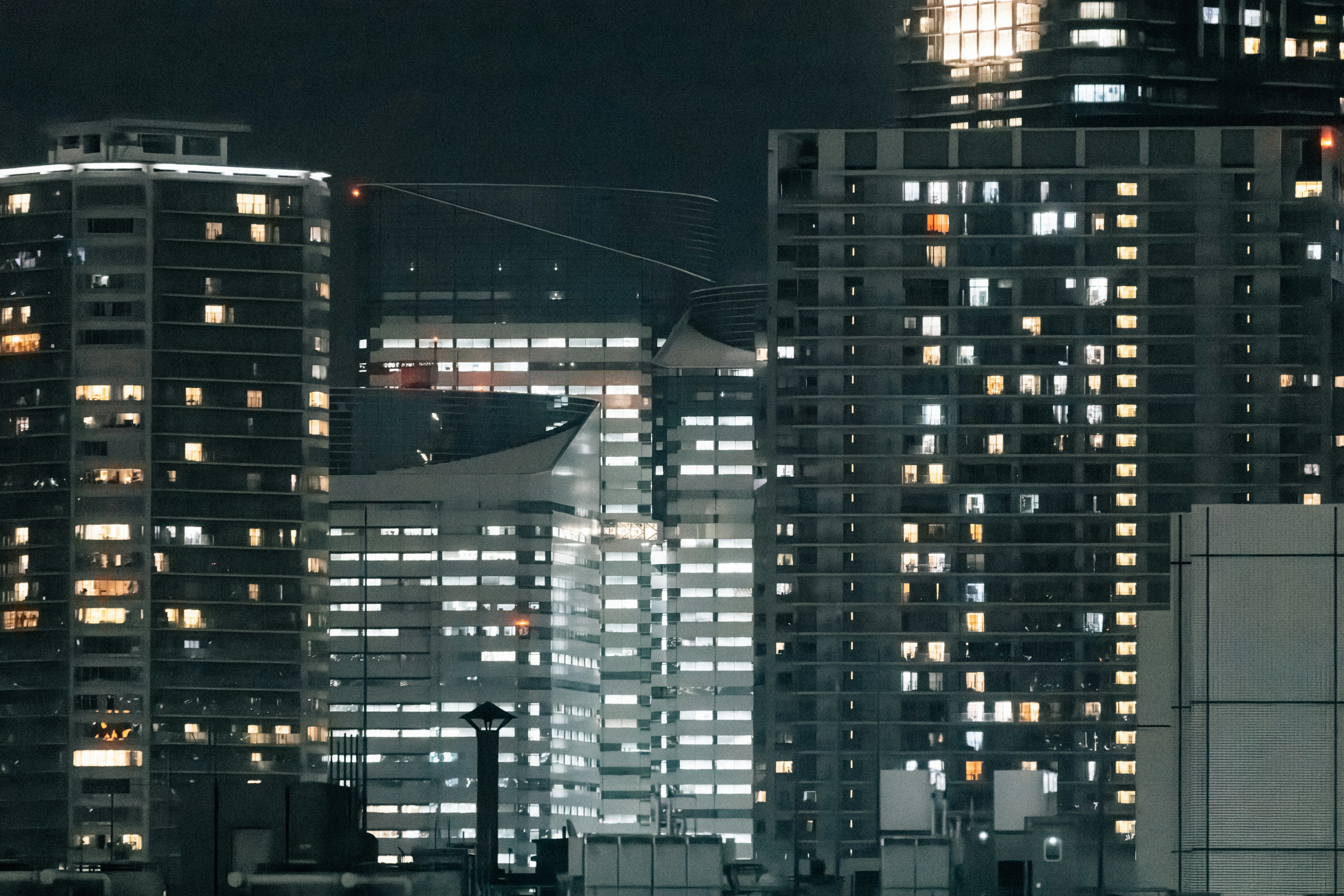 Modern city buildings illuminated at night